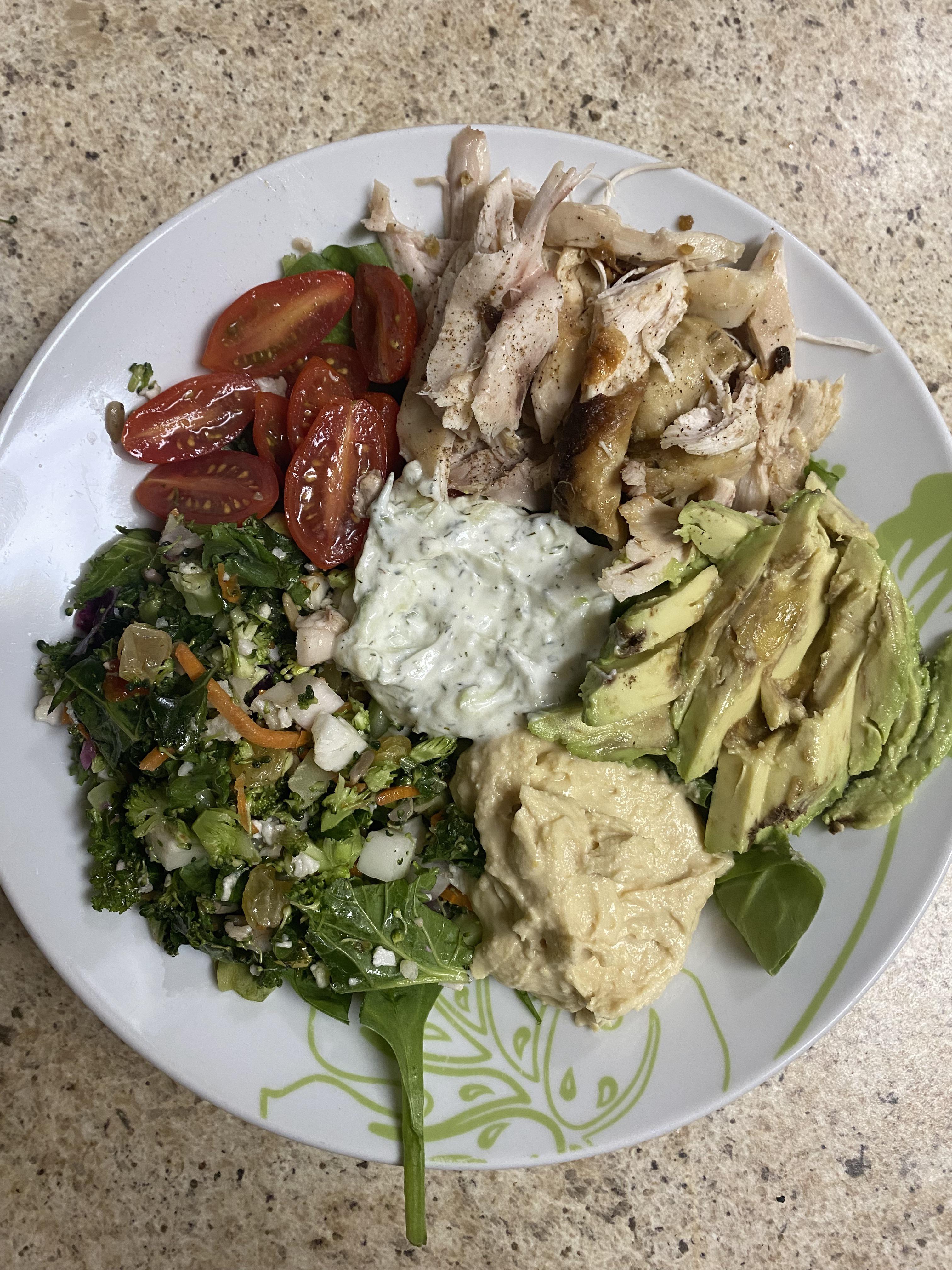 Leftover rotisserie chicken transformed into a tasty salad with hummus, avocado, tzatziki, and
