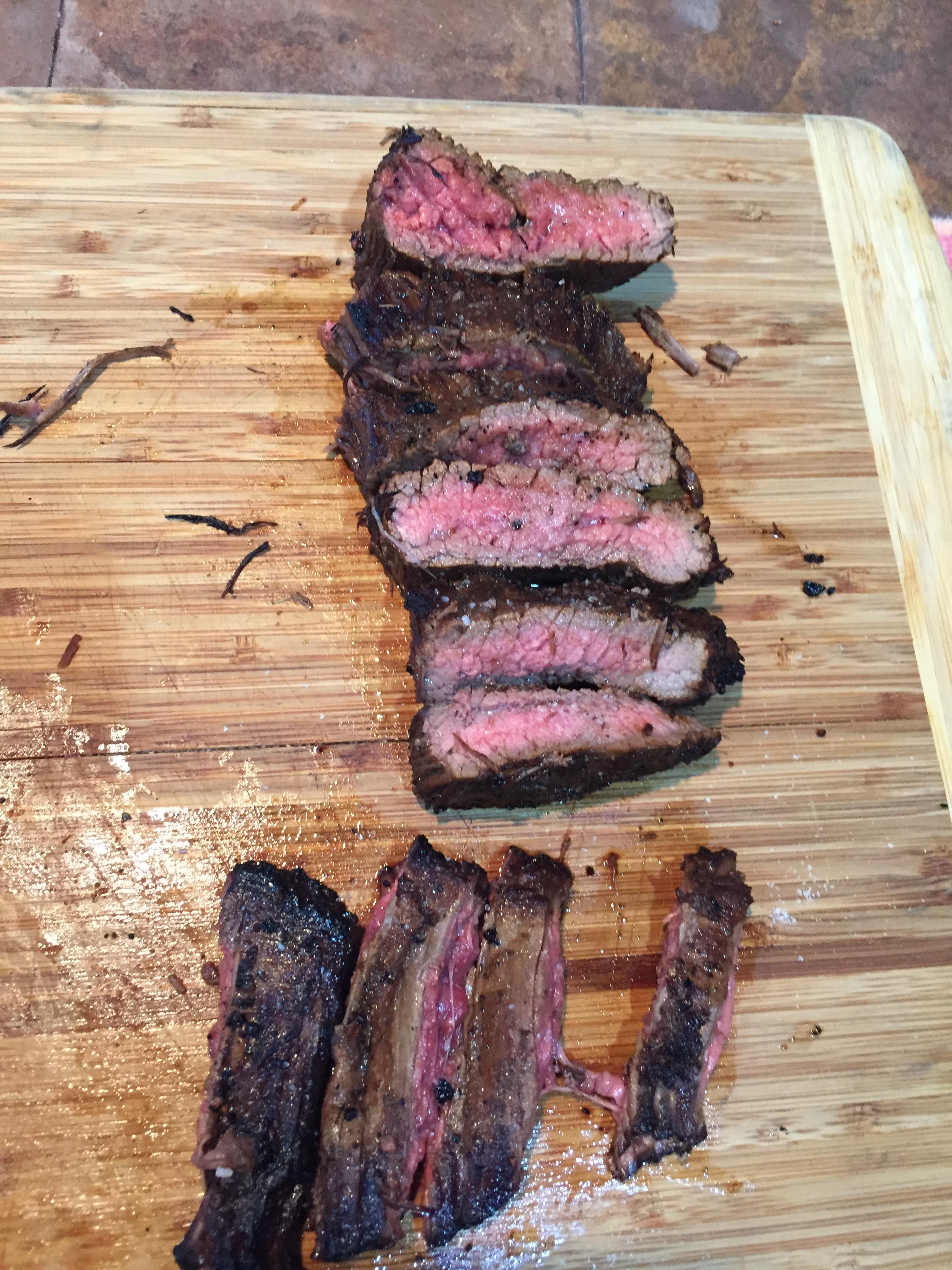 Cooked bison skirt (bottom) and flank marinated in a soy sauce mix r