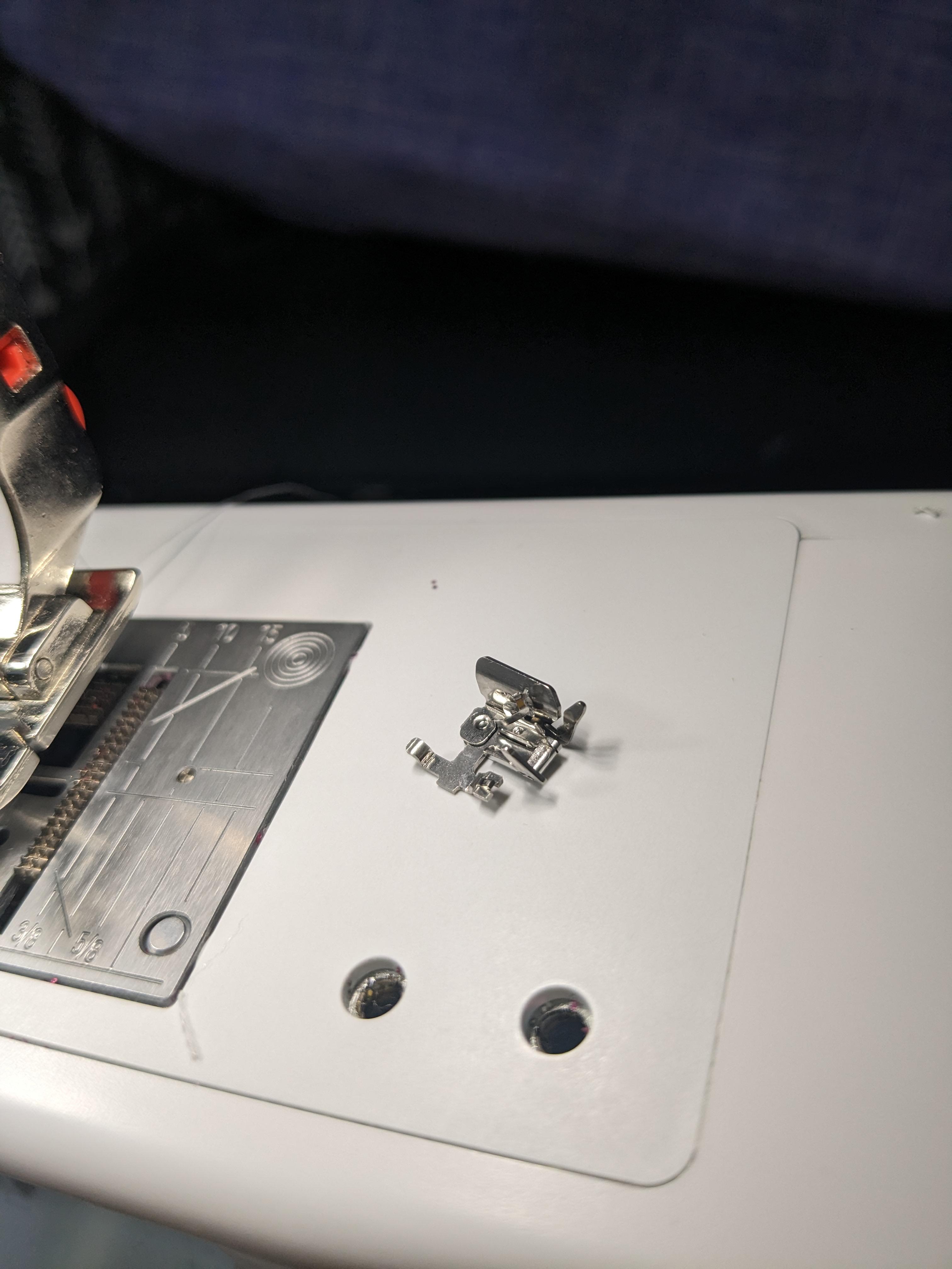 What is this part that just fell off my machine??? r/sewing