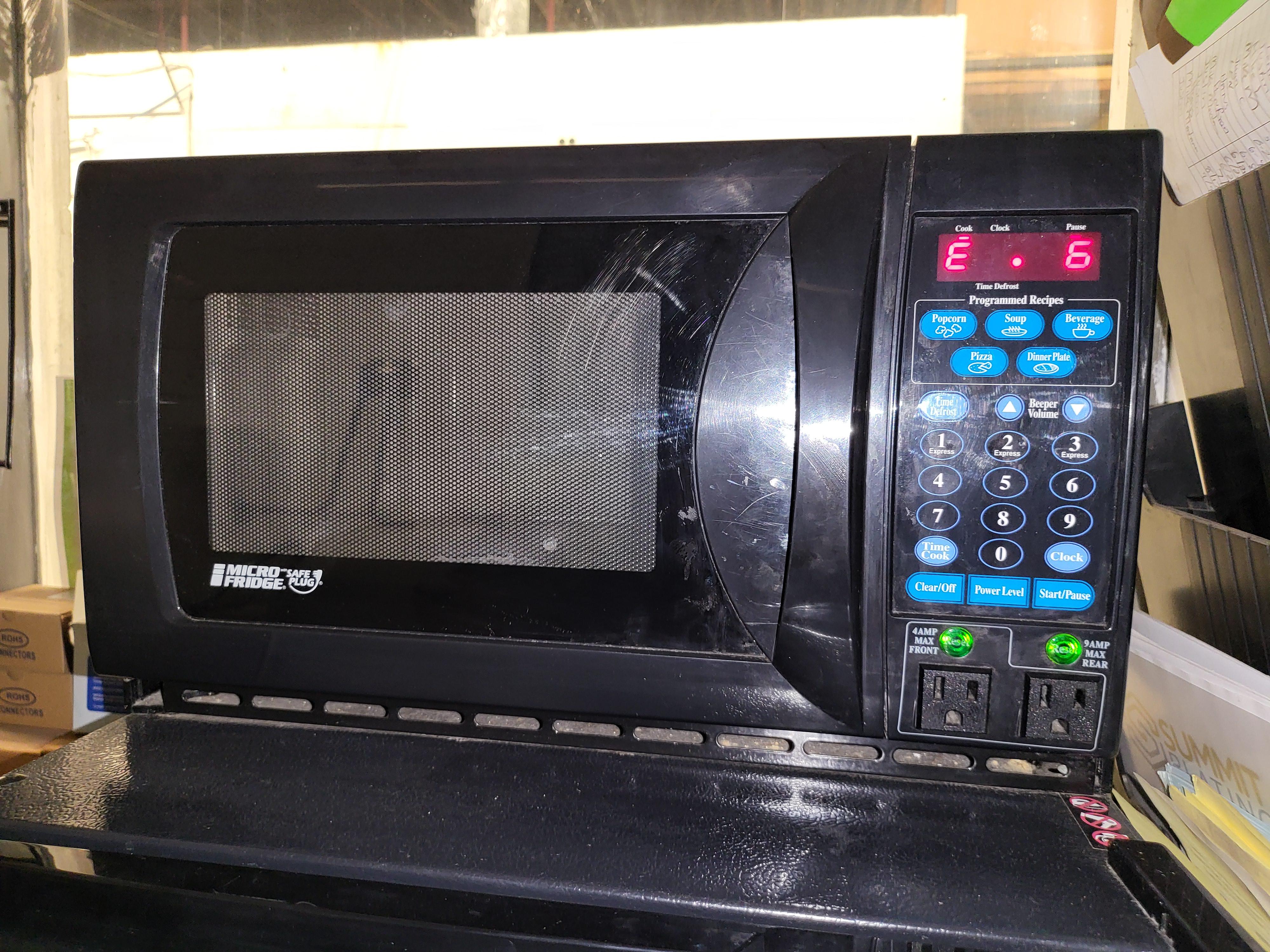 A microwave with builtin outlets. r/mildlyinteresting