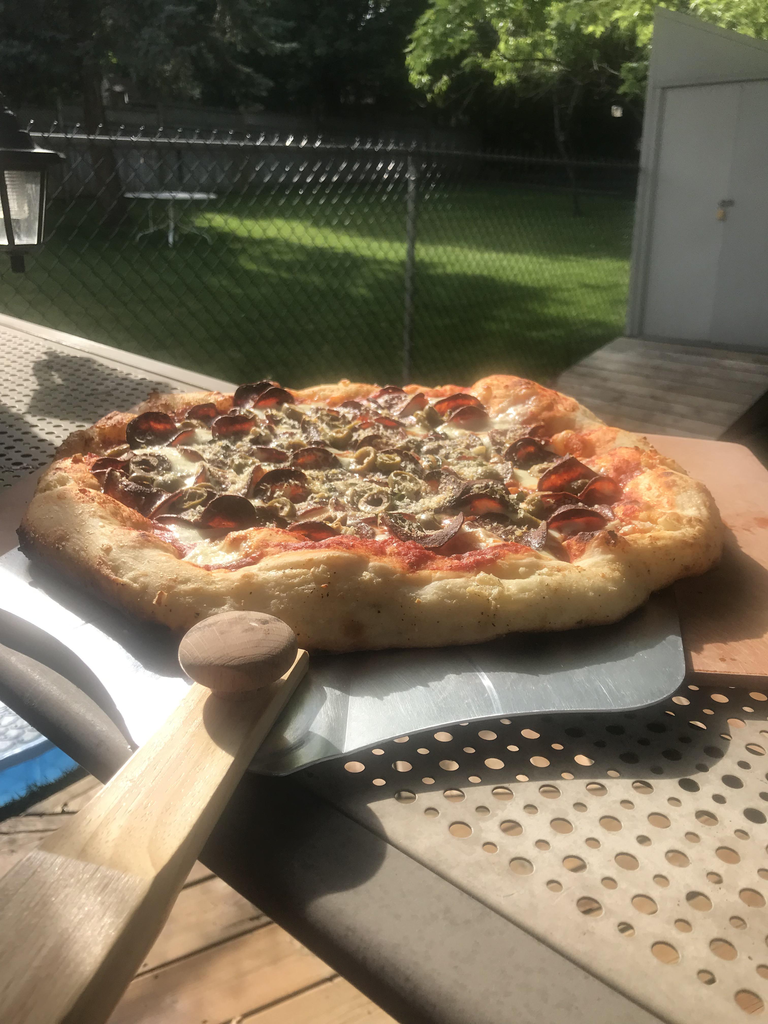 BBQ pizza, on a stone, pepperoni, basil and green olive. Classic here
