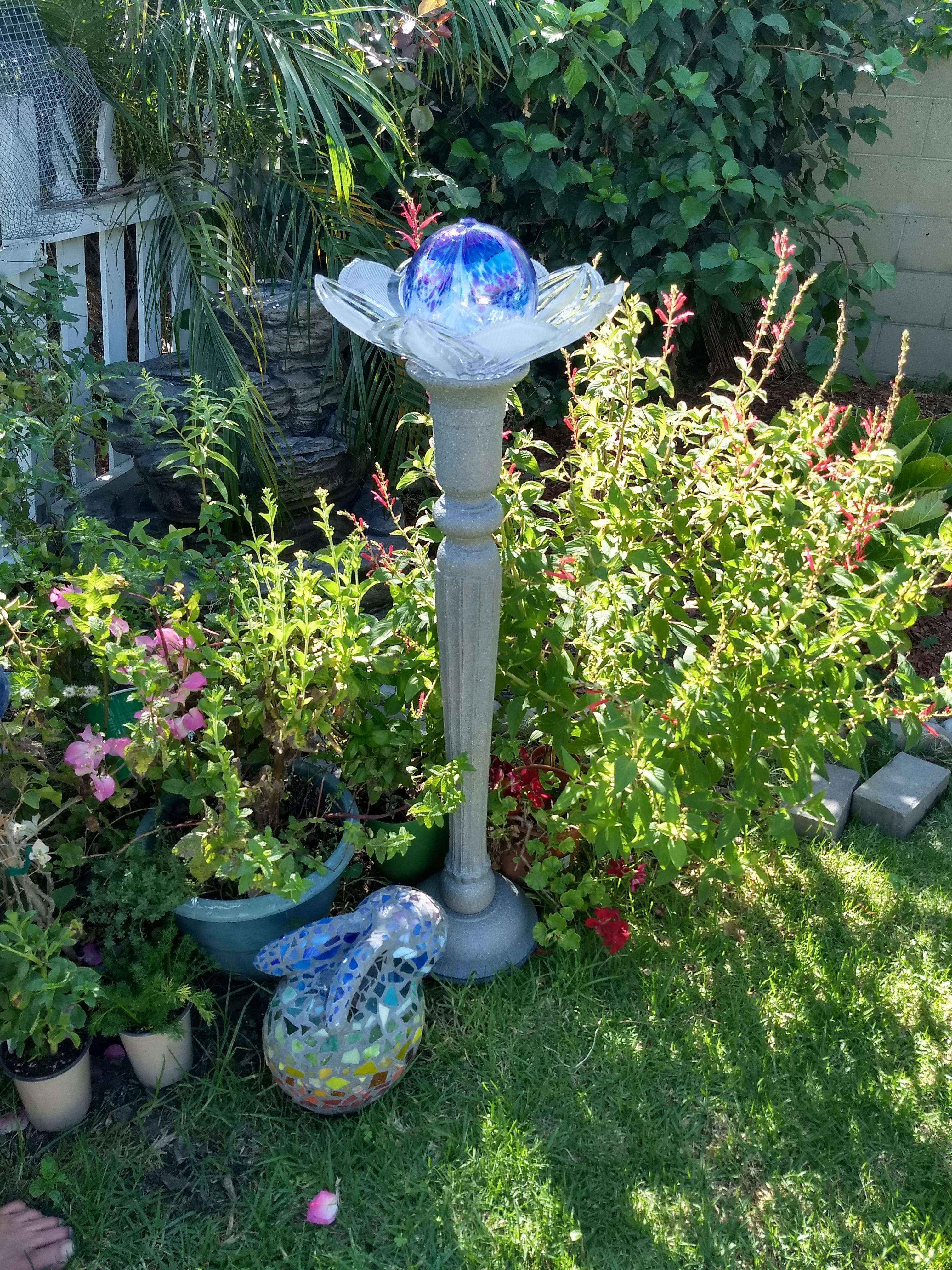 Made a bird bath from garage and estate sale finds. Candle holder