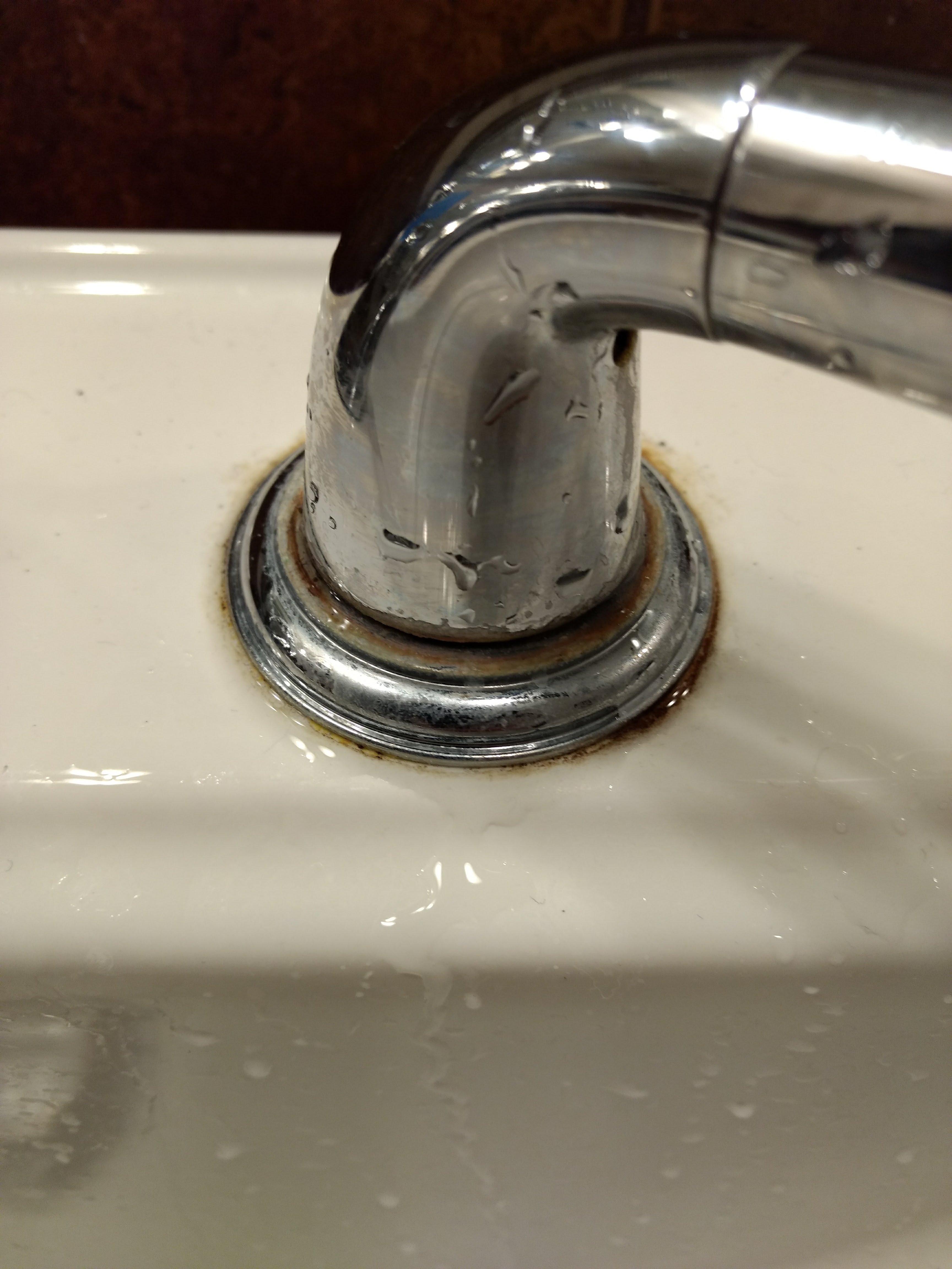 Water leaking from bathroom faucet handle, right above the ring