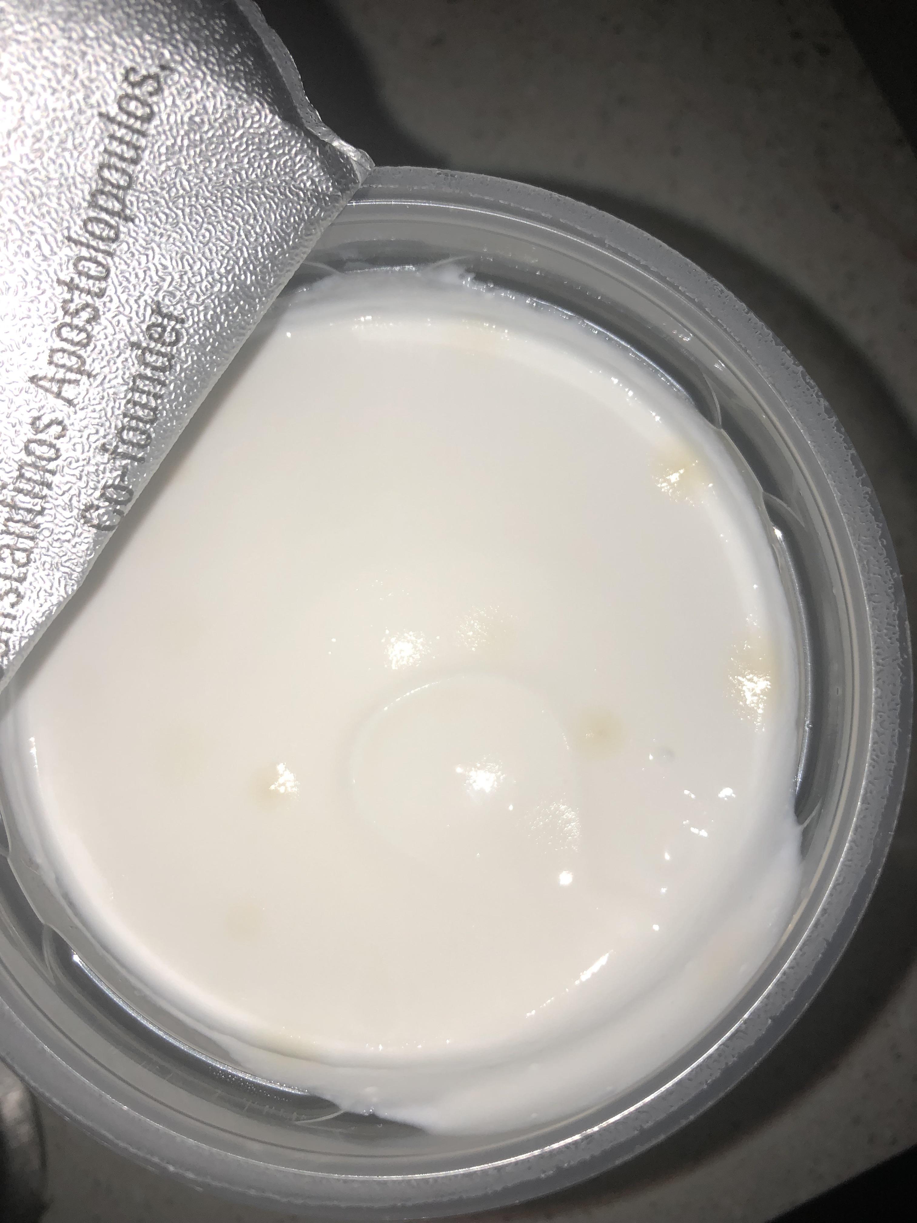 I just bought a yogurt and saw these spots…. Is it bad or mold? r