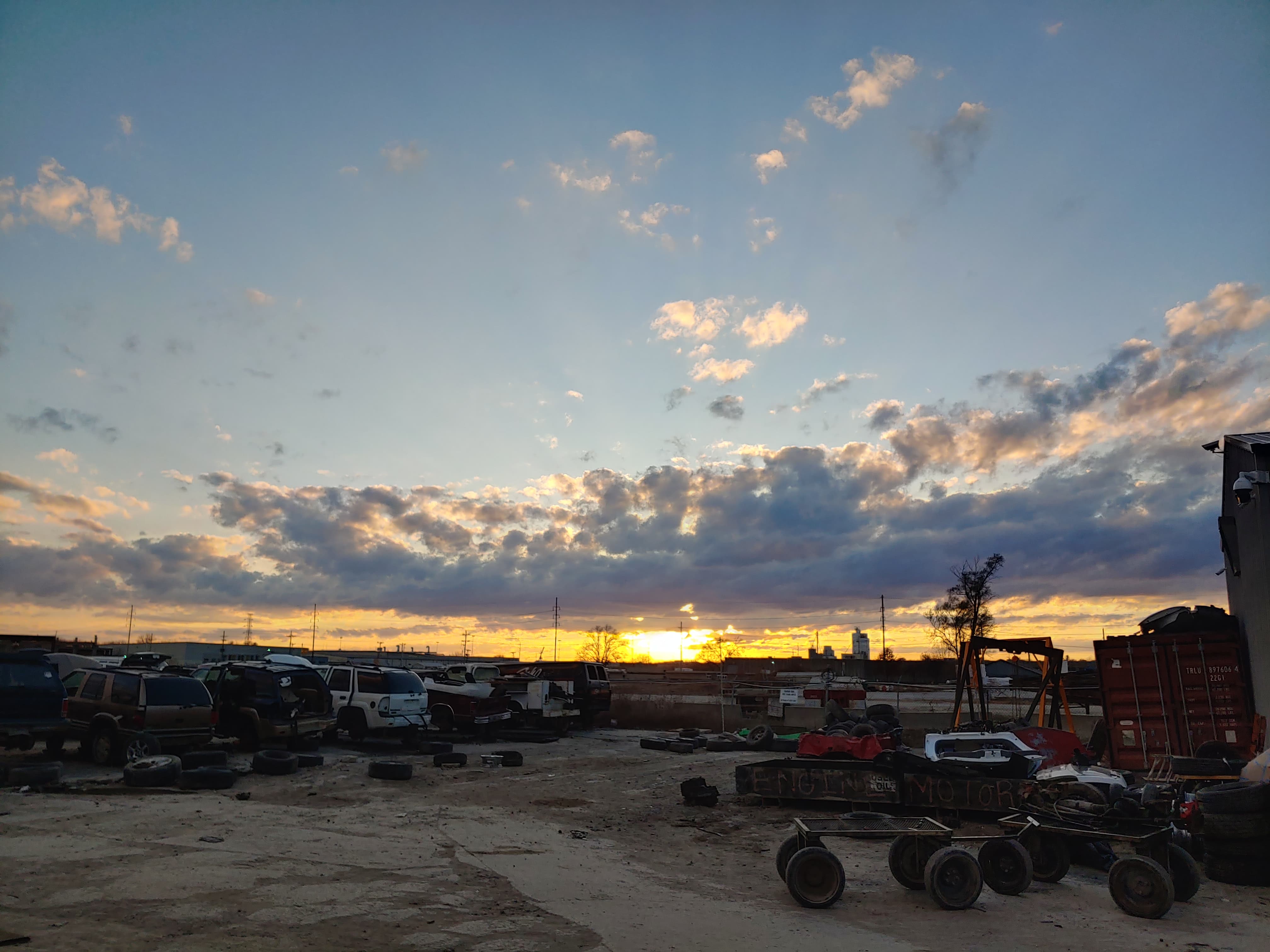 Sunset over the junkyard I work at. r/pics