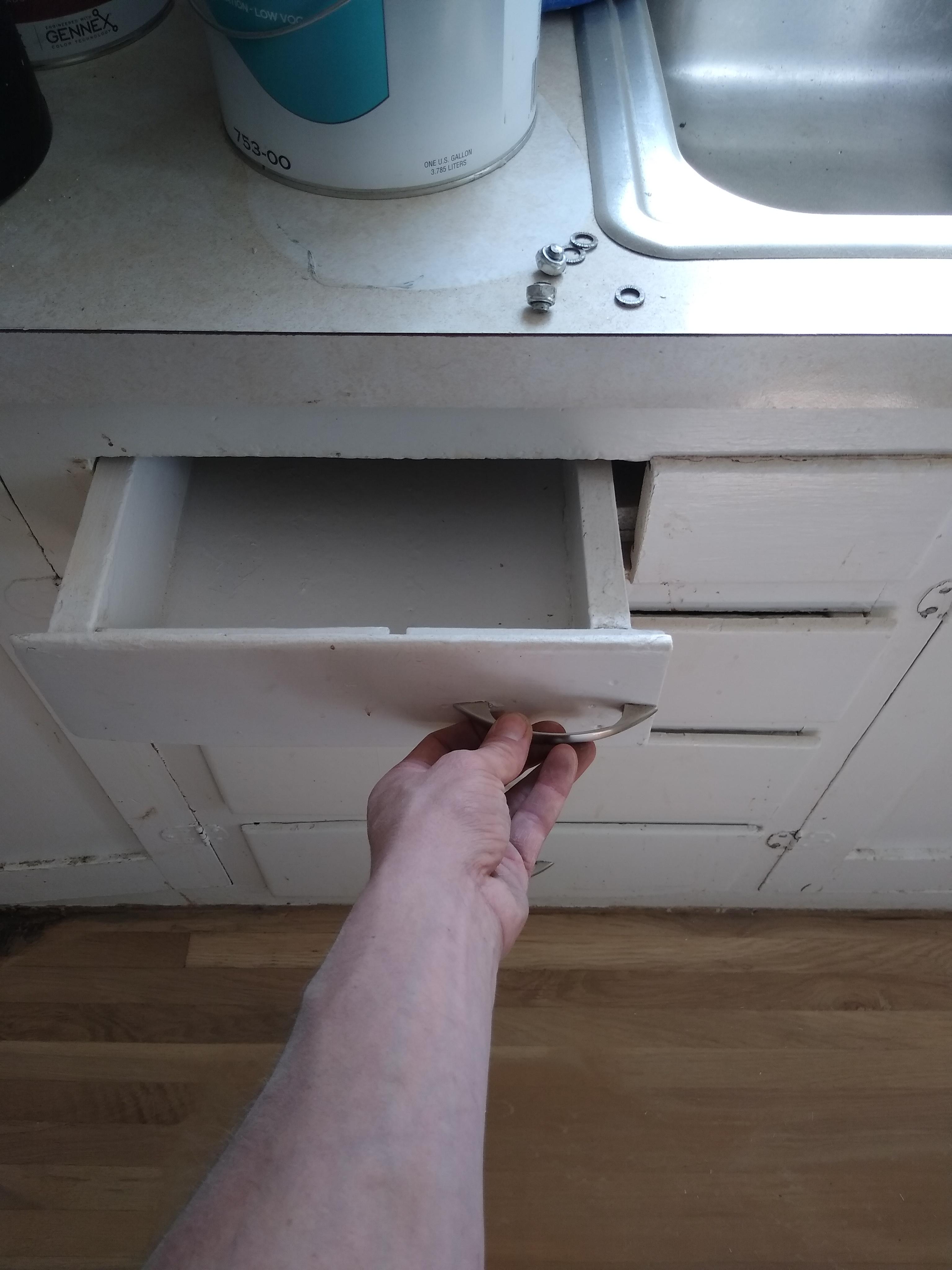 That's one way to utilize a drawer that hits the sink I suppose. r