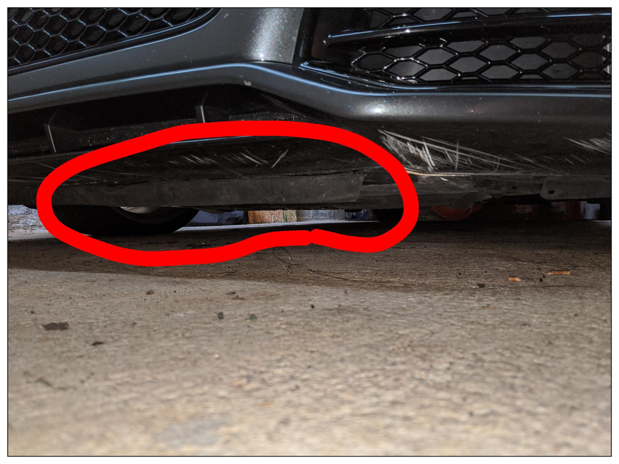 Rubber piece underneath front bumper coming loose. No idea what this is