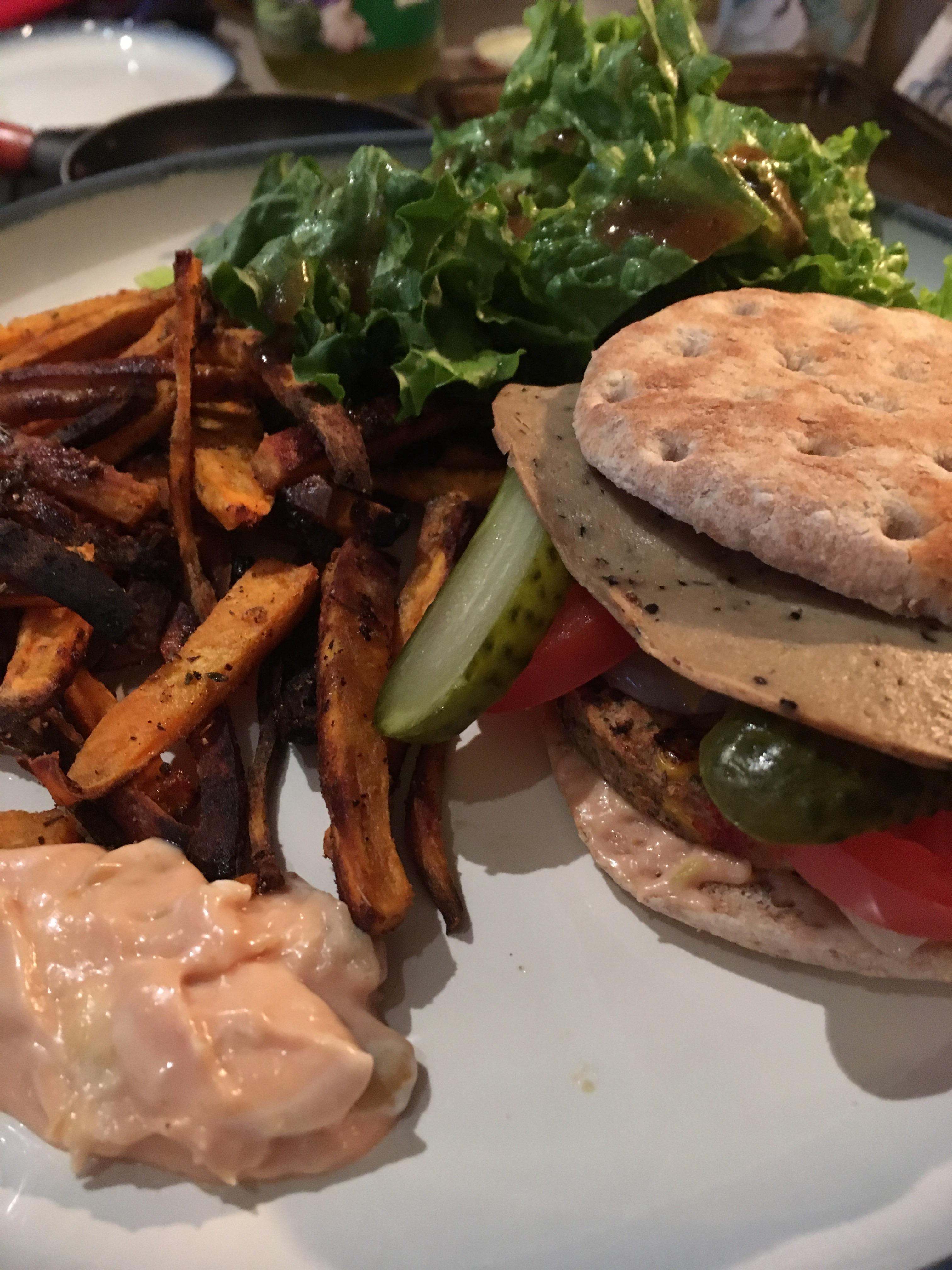 Black bean burger (Costco) with Tofurky deli slice, carmelized onion