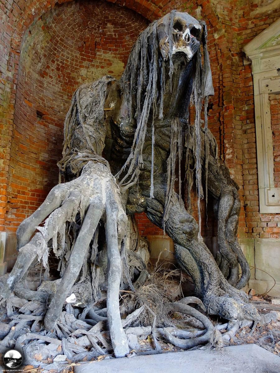 Abandoned demon statue at a polish mausoleum interestingasfuck