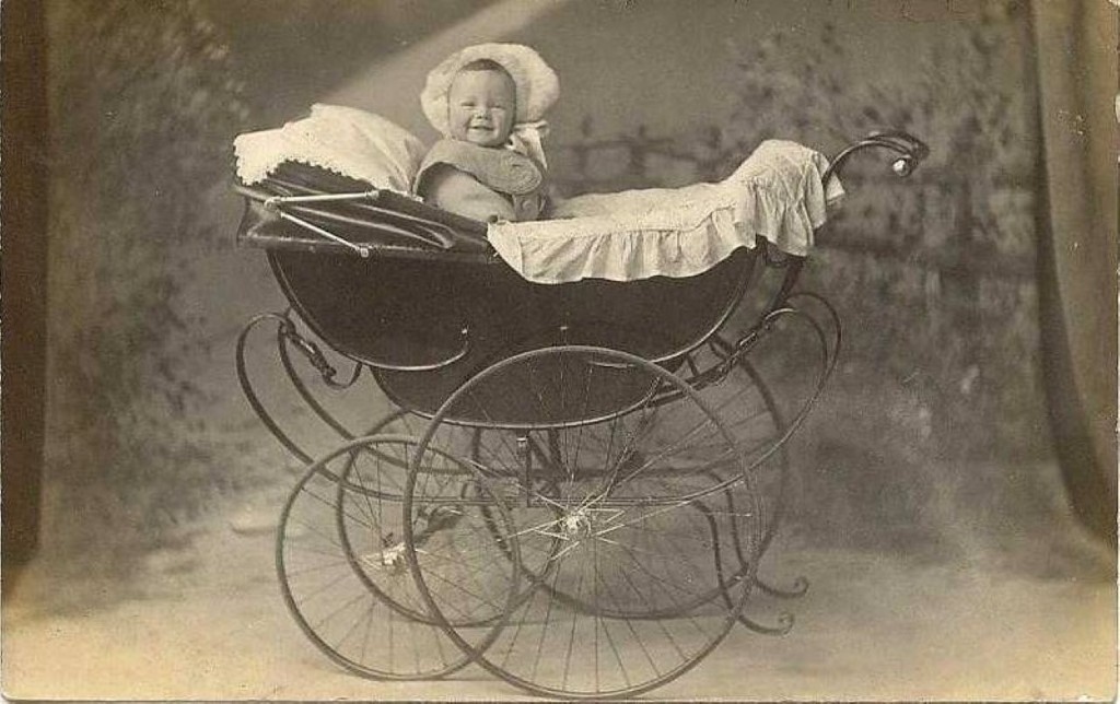 Retro baby carriage with a smiling baby. 1890s. r/OldSchoolCool