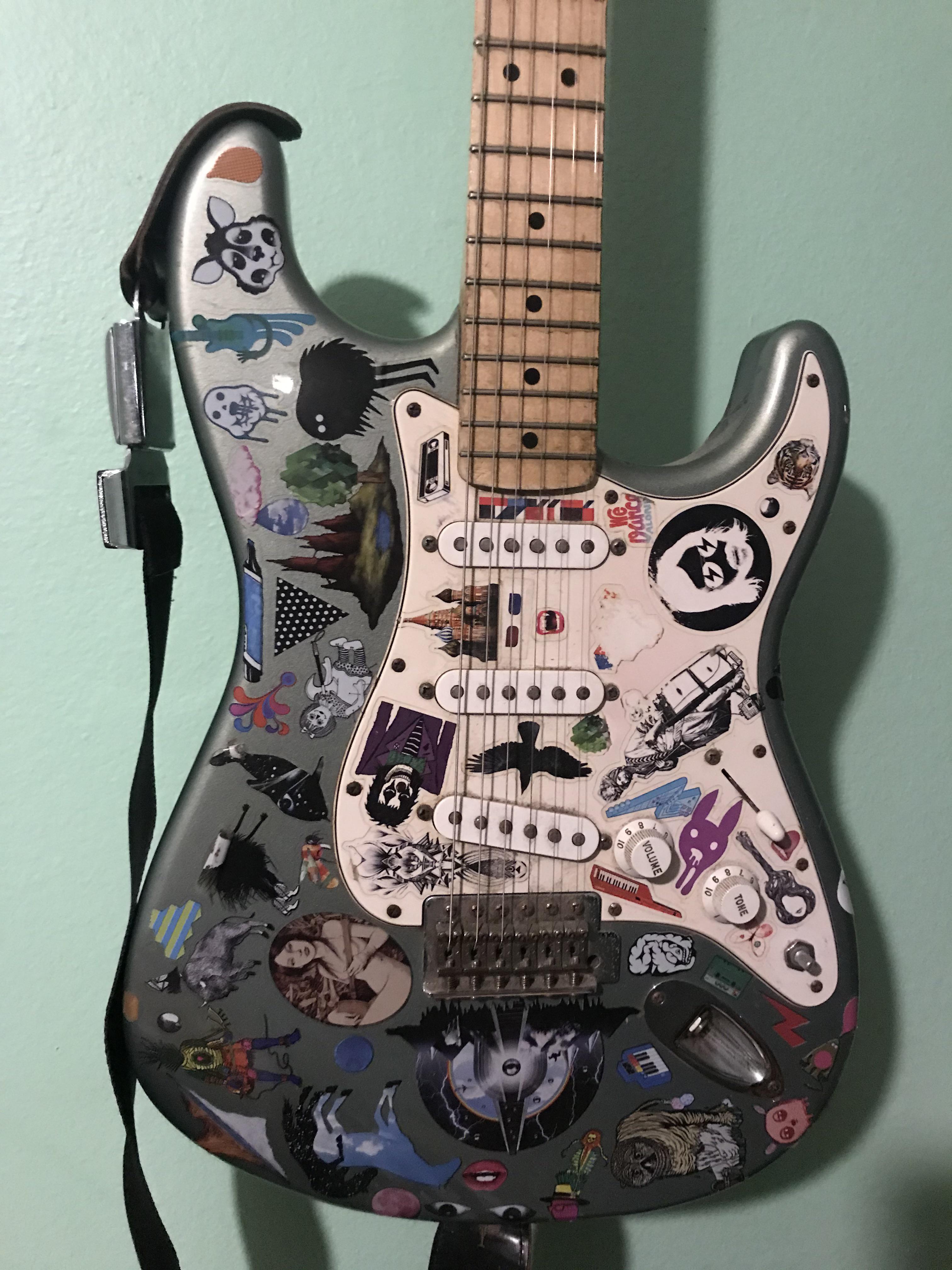 My Fender Strat decked out with some stickers I got off The Information