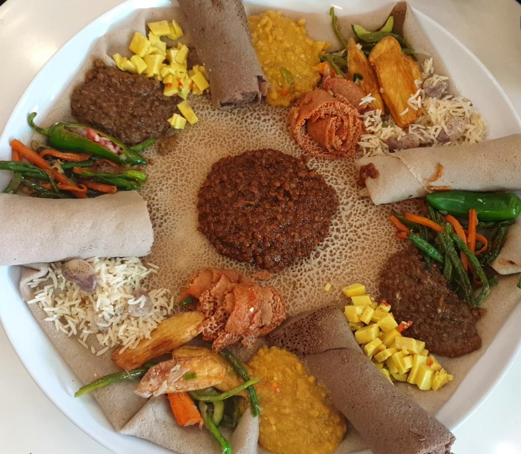 [I ate] Ethiopian platter served with injera, lentils, beans and