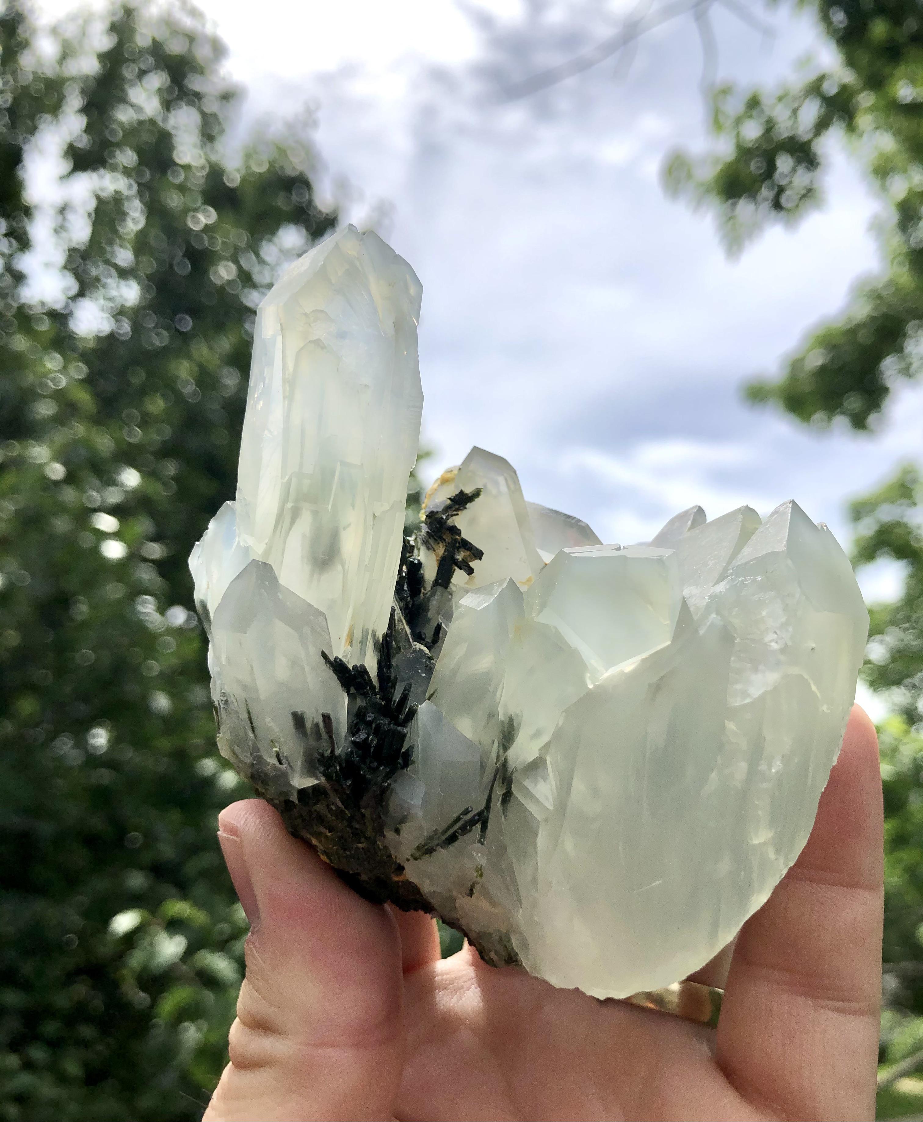 I love the slightly deformed quartz crystal growth here with inclusions