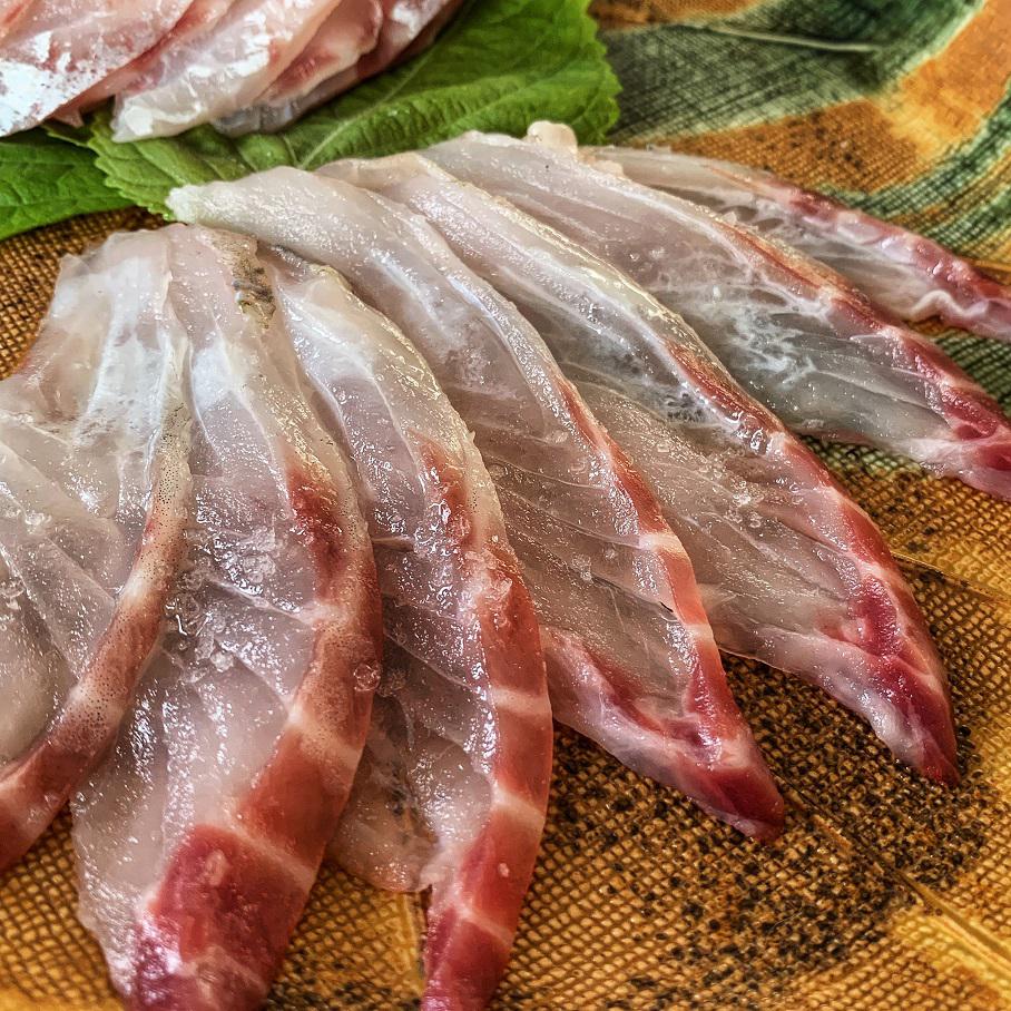 Closeup of homemade aged sea bass sashimi r/sushi