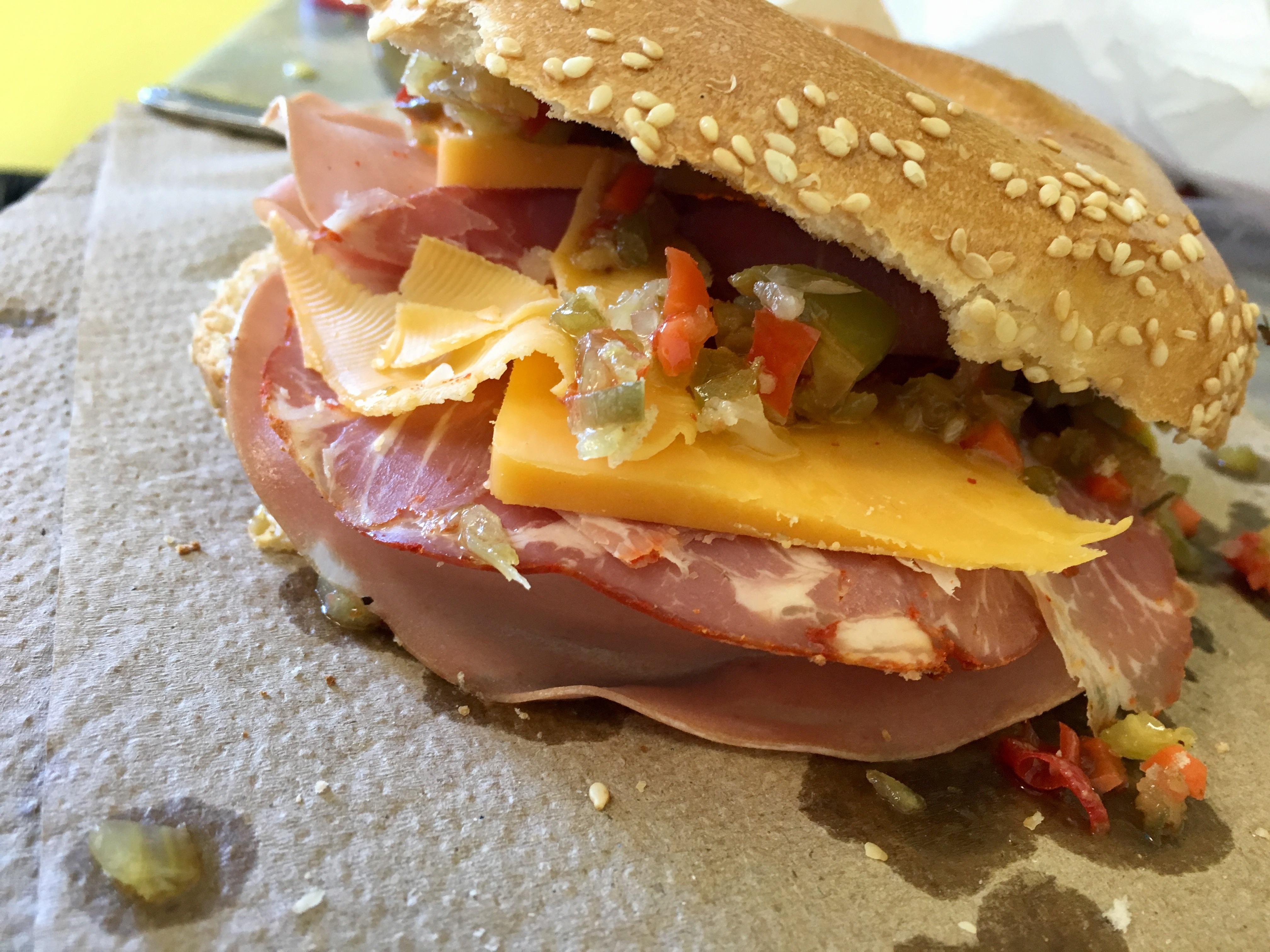 Mortadella capocollo with muffuletta spread and aged cheddar between a