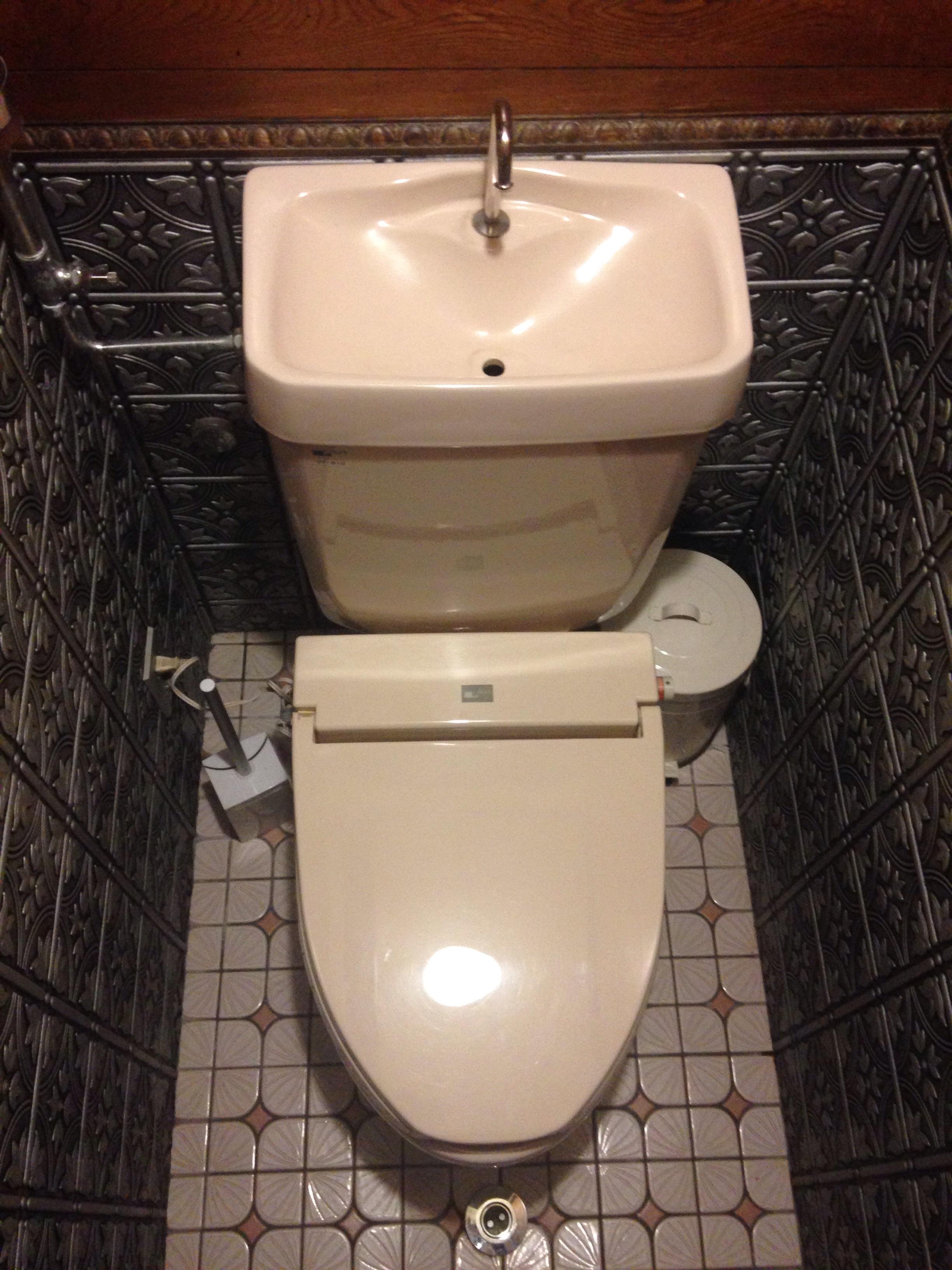 This Japanese toilet has a hand basin right into the cistern. r