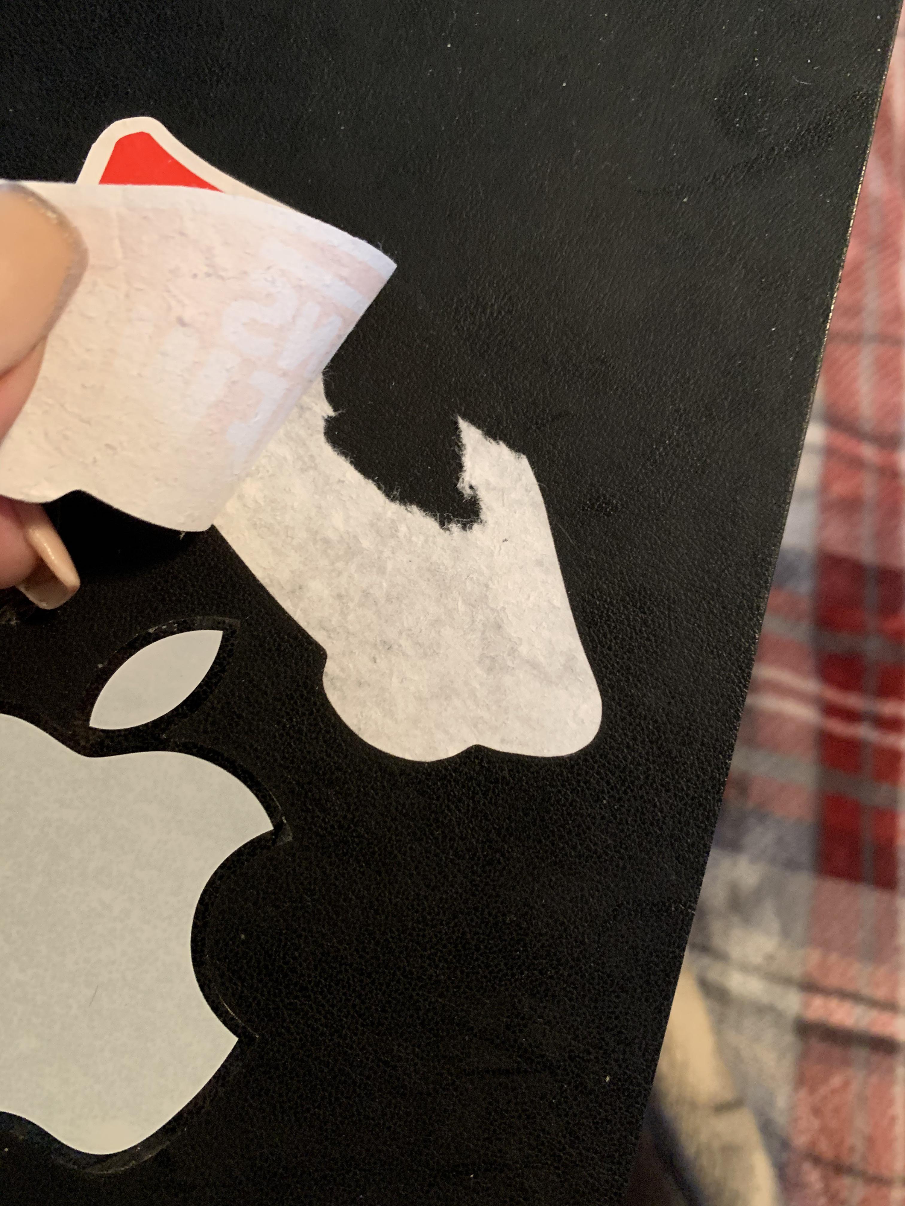 does anyone know how to remove stickers on a moleskin leather notebook