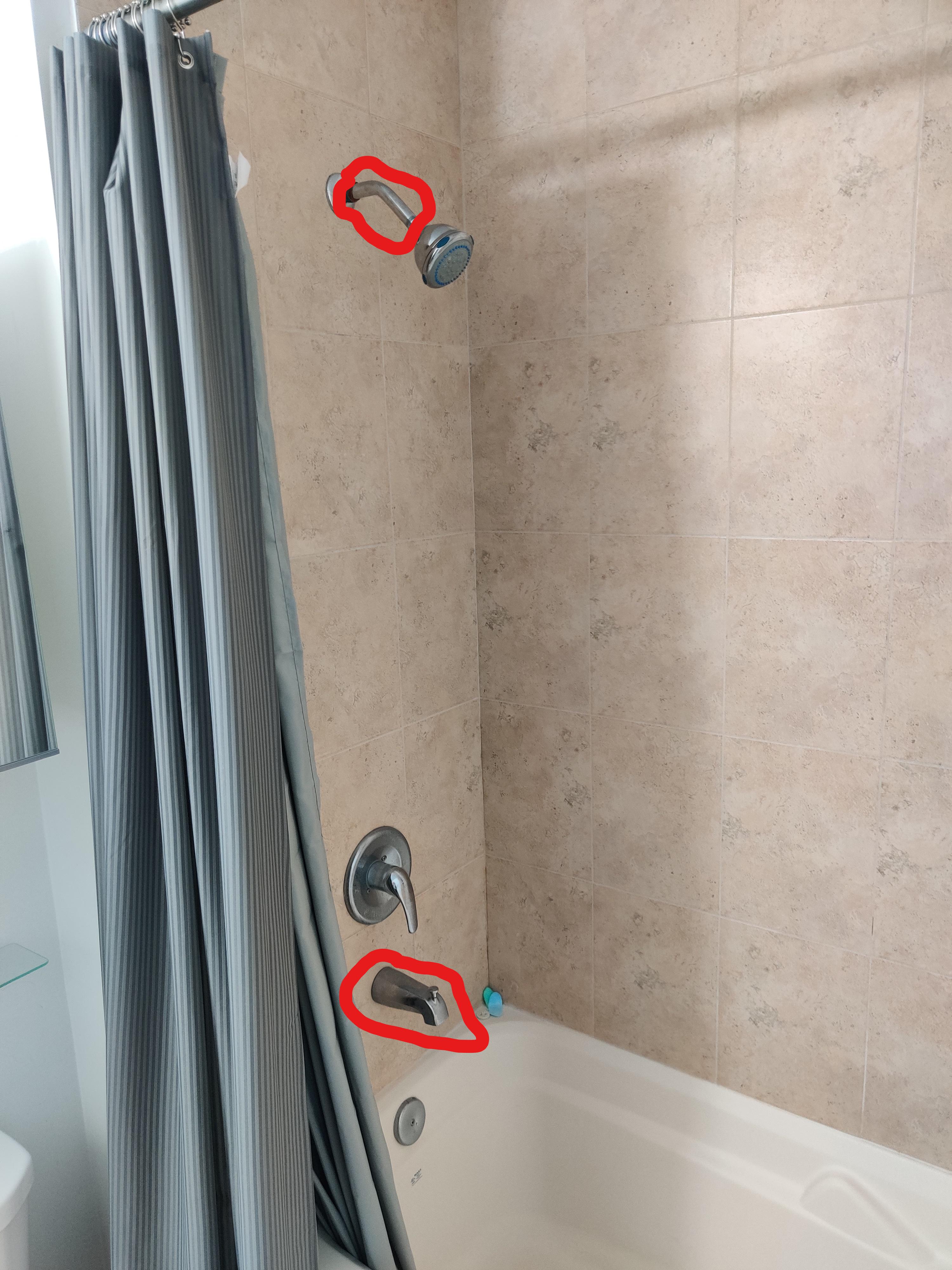 I want to replace the bathtub faucet and the shower arm (circled). Can