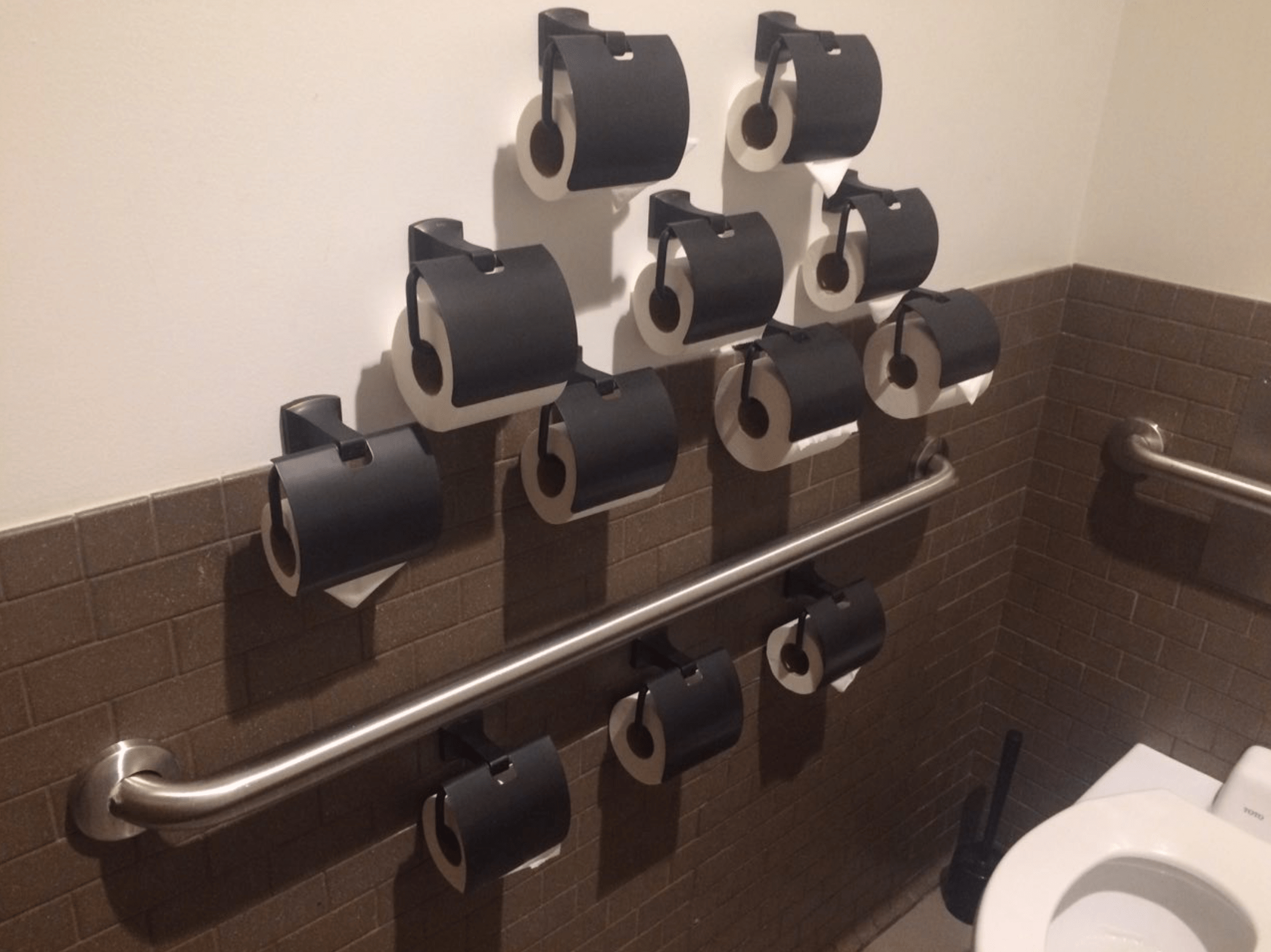 This restroom's army or toilet paper rolls r/mildlyinteresting