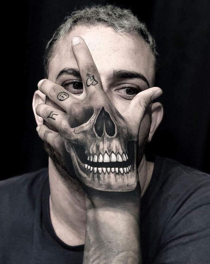 Hand skull by Andre Felipe, an artist at New Look Tattoo Studio in Belo