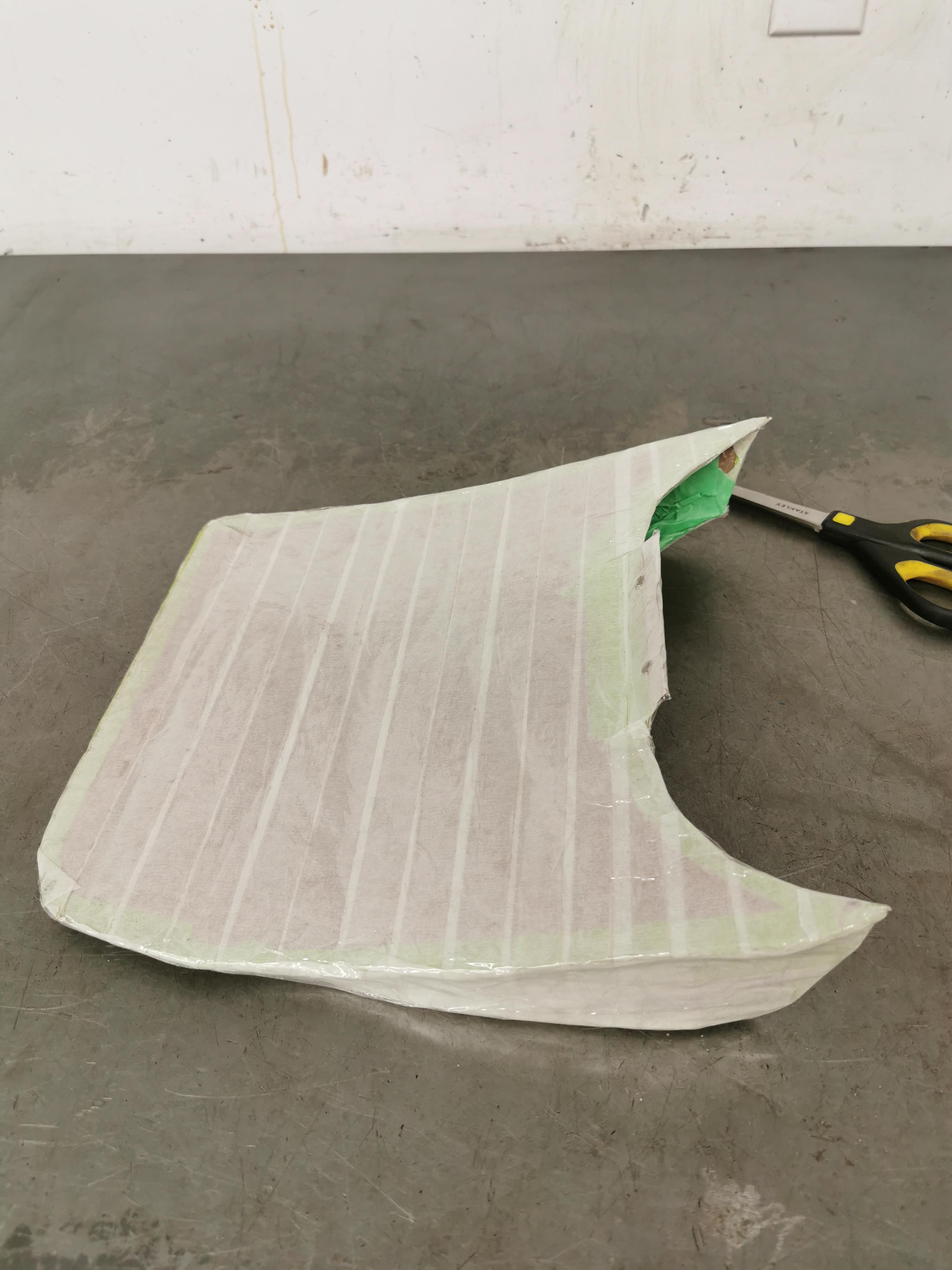 Trying to make a fiberglass spoiler. I made this out of cardboard, then