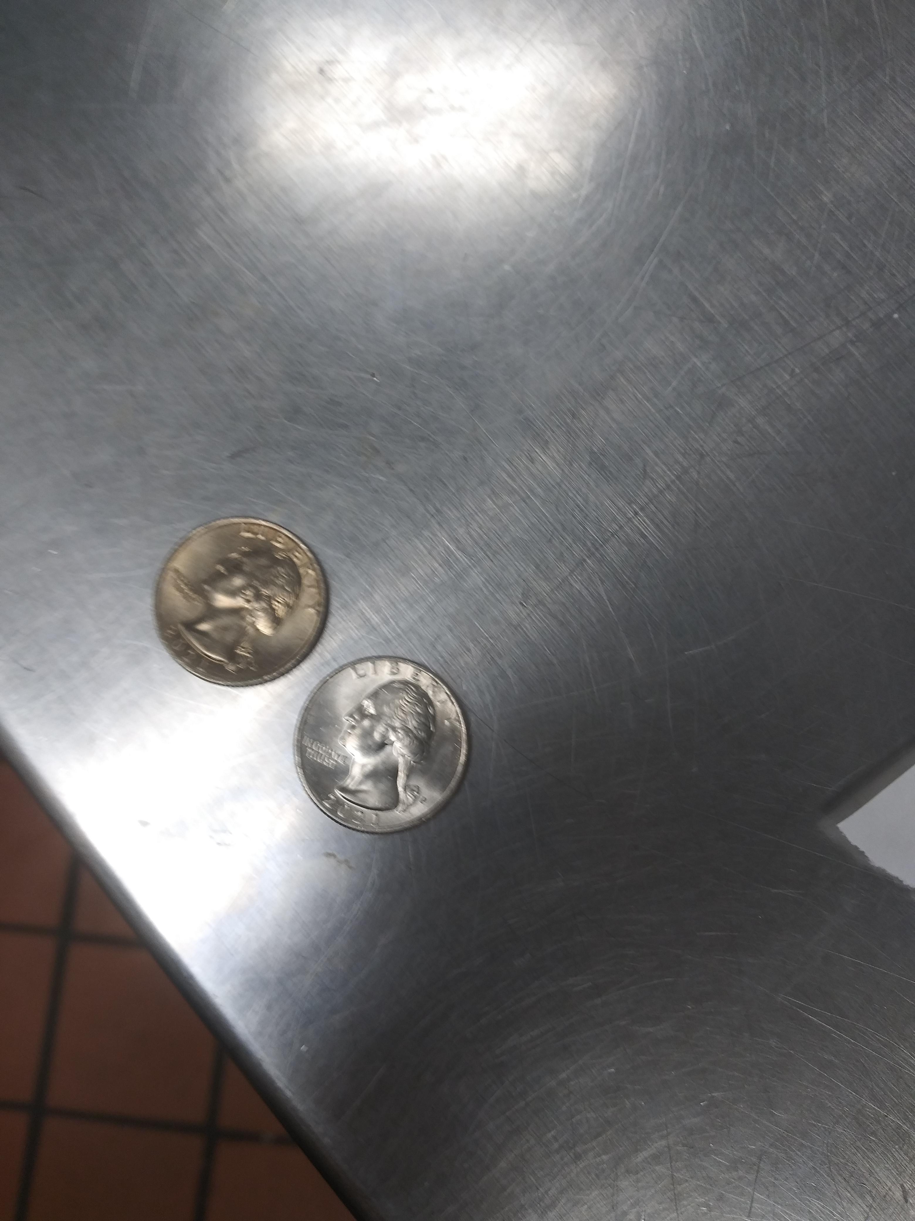 i have two 2021 quarters yet one has a bronze coloration any ideas? r