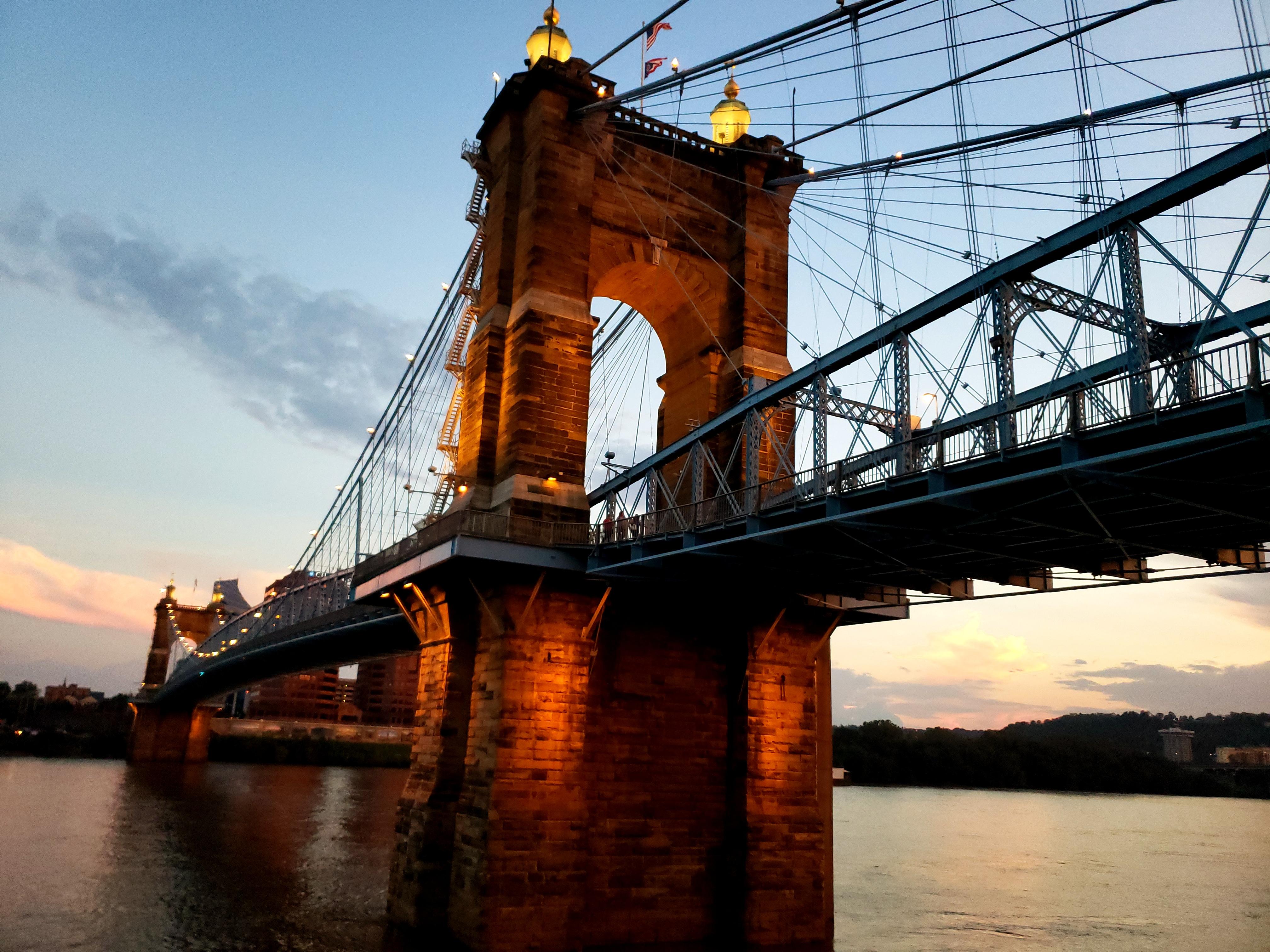 The John A. Roebling Suspension Bridge in Cincinnati, Ohio. The sunset