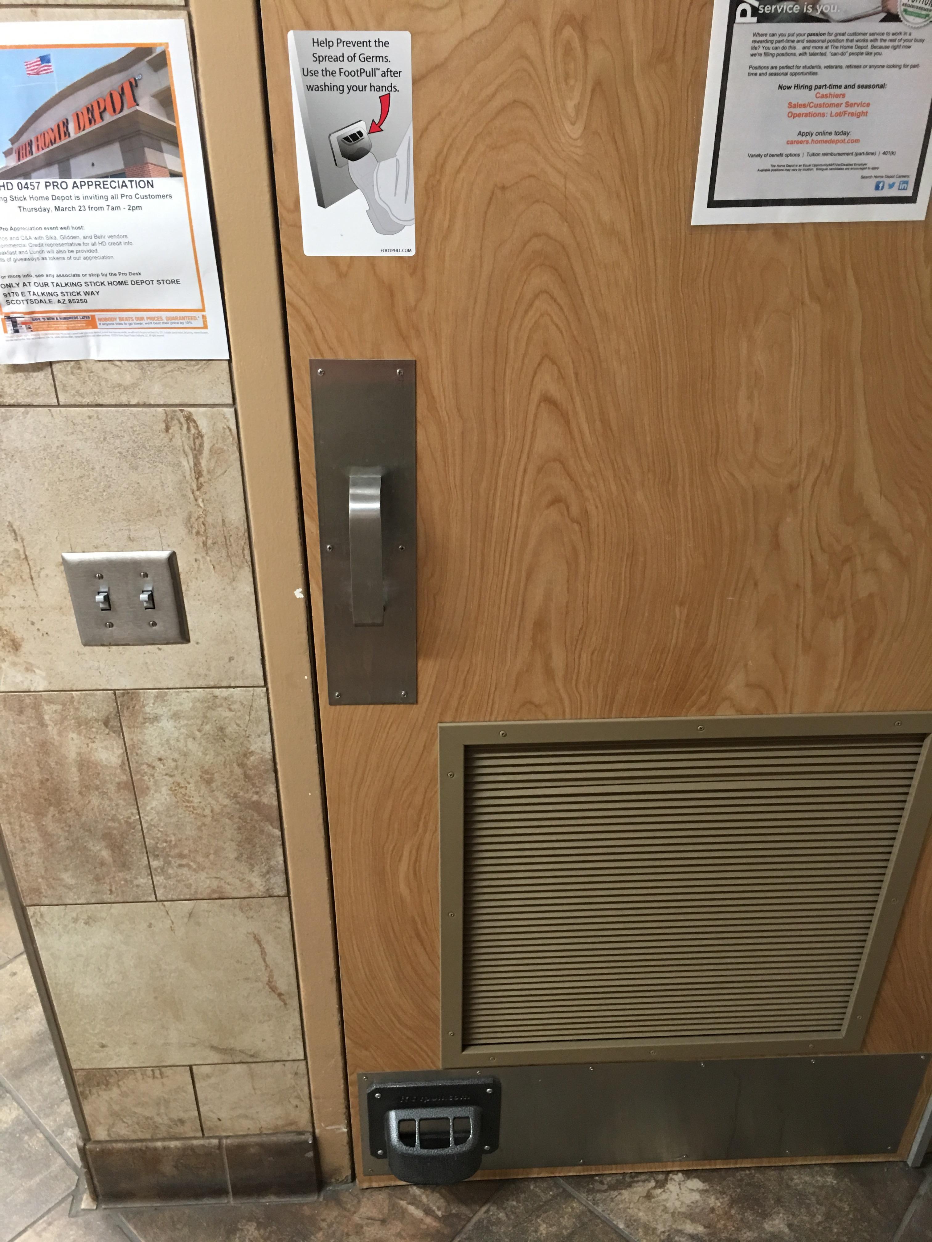 This Home Depot has a "FootPull" for the bathroom door r