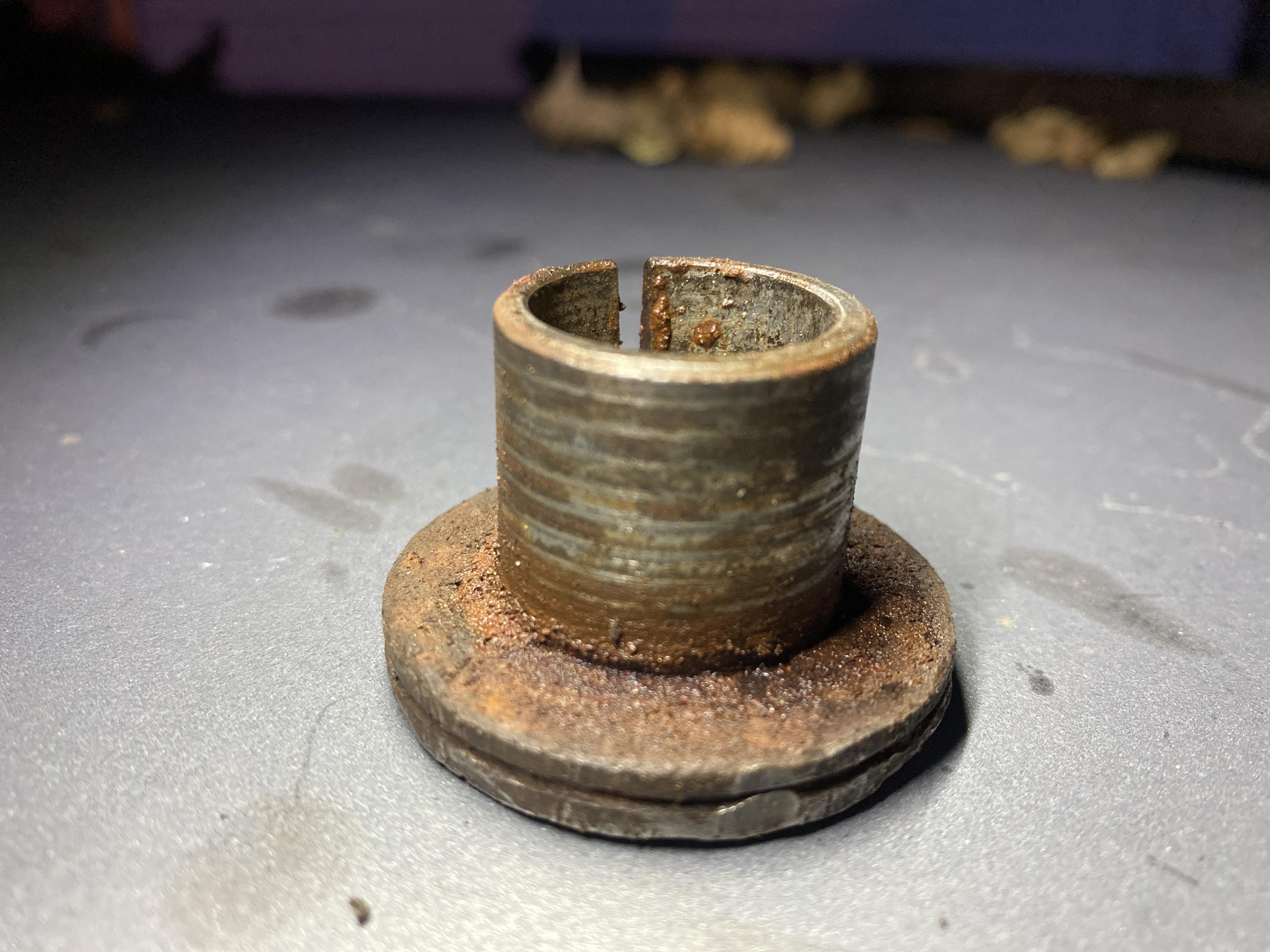 The upper ball joint adjustment sleeve on the right side of a Dana 44