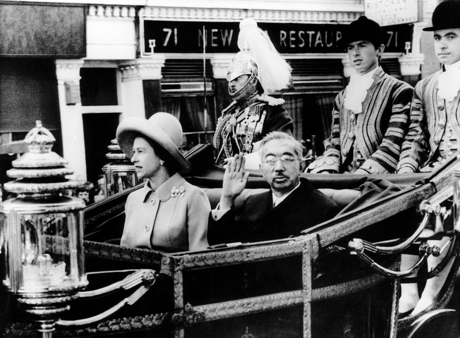 Queen Elizabeth II and Japanese Emperor Hirohito, ride a carriage from