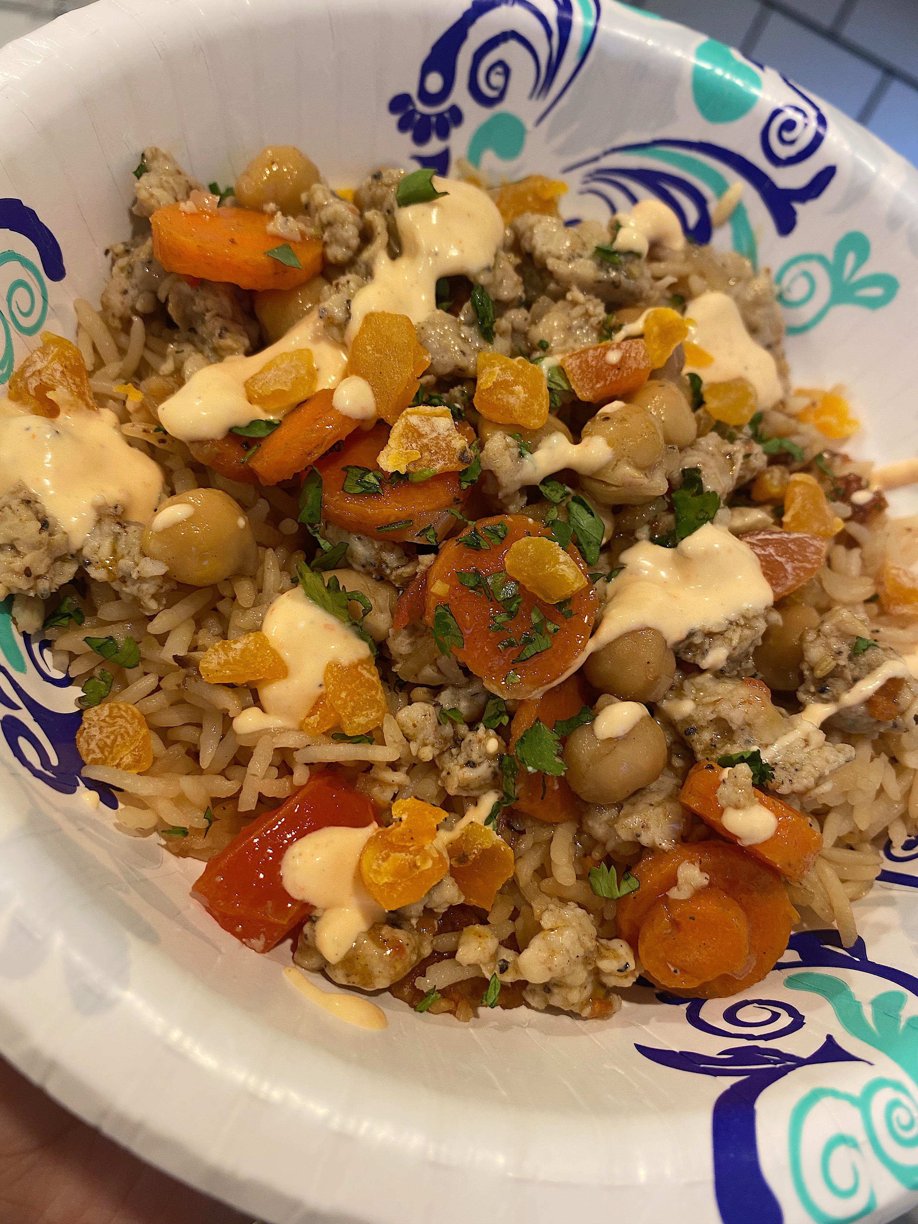 Moroccan chicken sausage tagine with dried apricots and chickpeas over