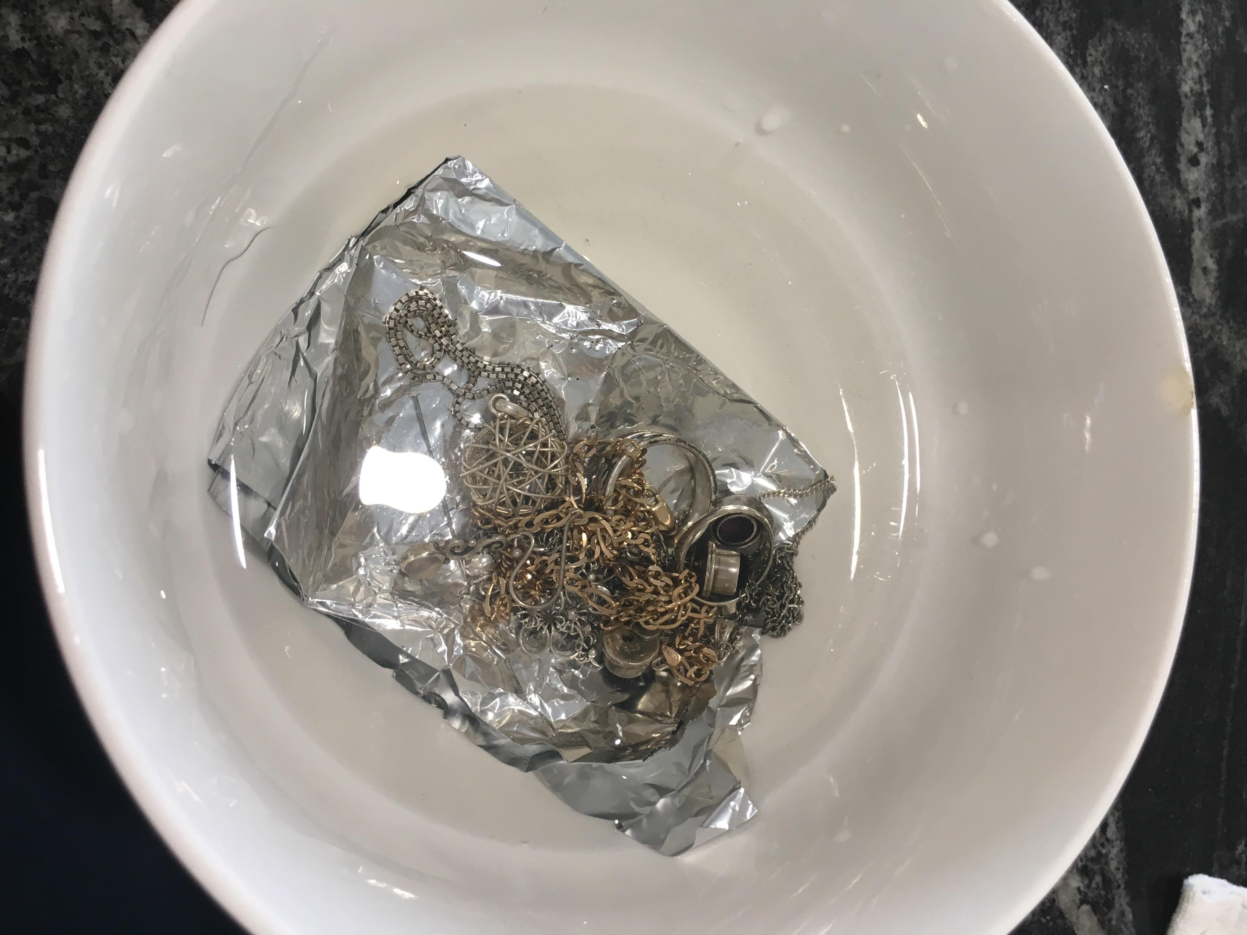 Clean jewellery with just aluminium foil and warm salted water. Leave in for a while then polish