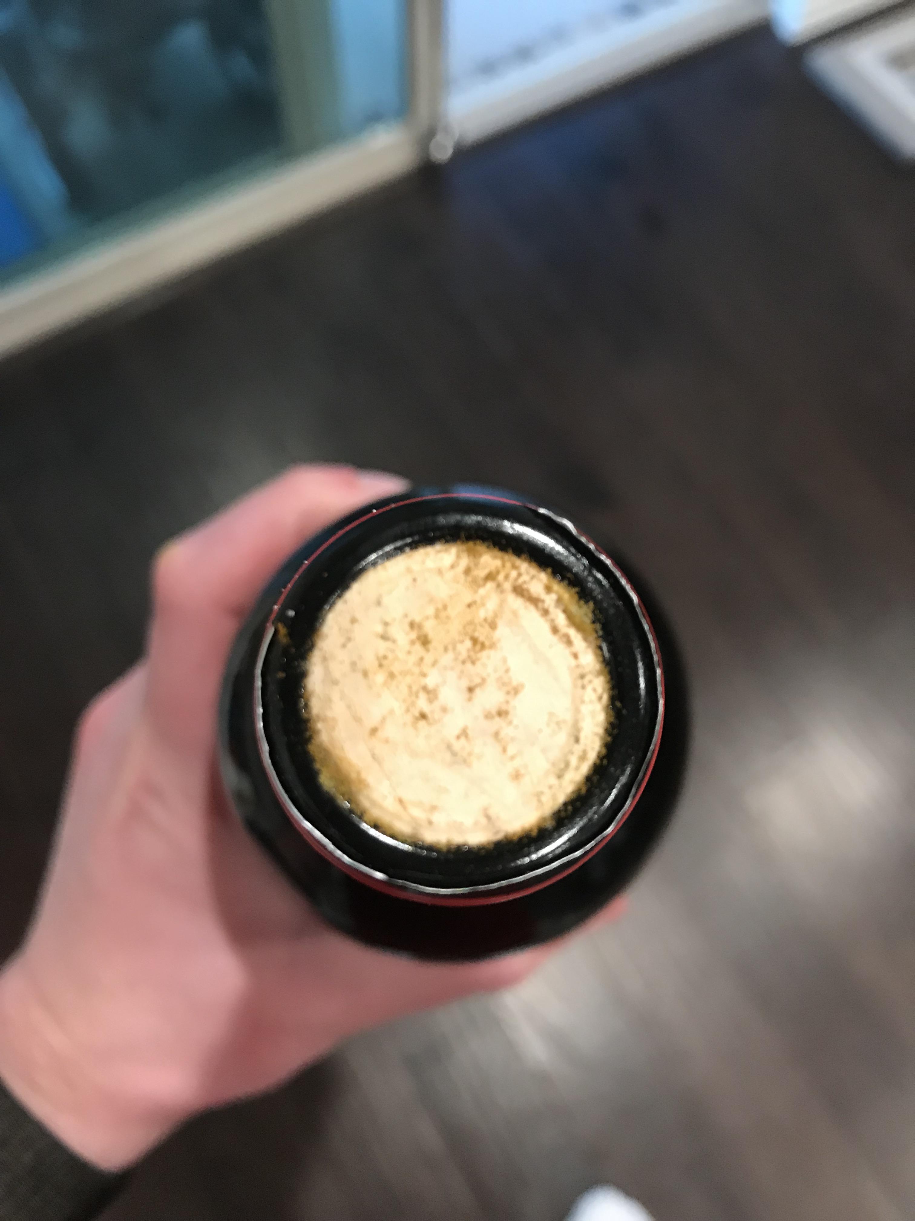 Anyone know what causes this on the cork? Pulled from my wine fridge