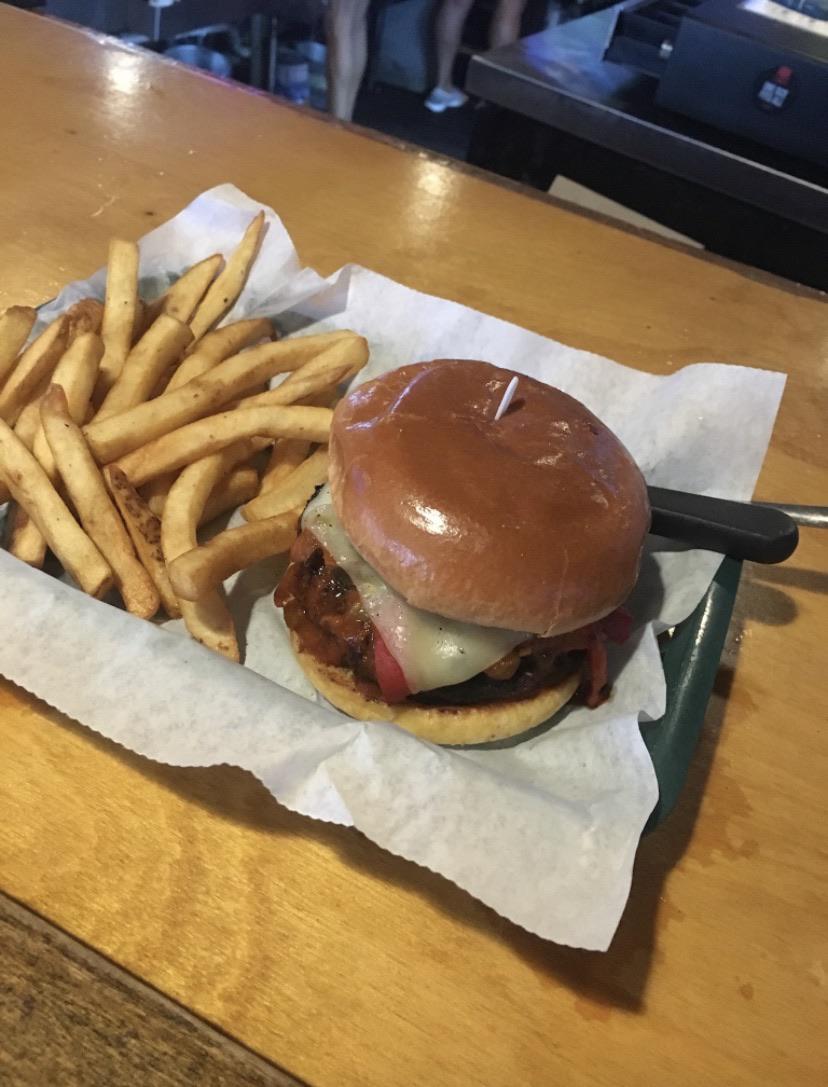 Spicy bayou burger with melted pepper jack cheese and a marinated