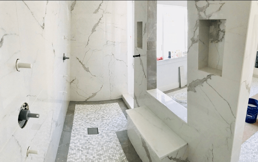 Double entrance shower! Mitered corners were filled with epoxy and sanded down smooth r/Tile