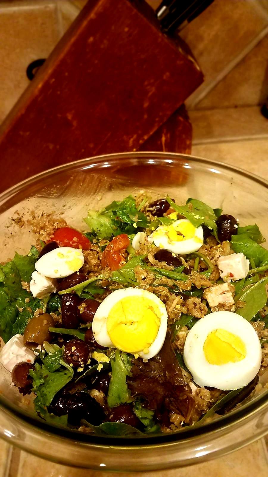 Homemade tuna salad with white quinoa, spinach, spring salad, tomatoes