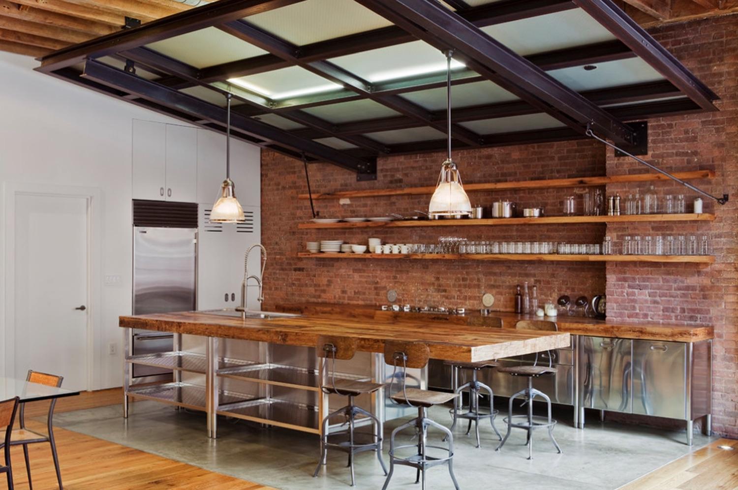 Industrial kitchen with a mix of steel, brick, and wood in