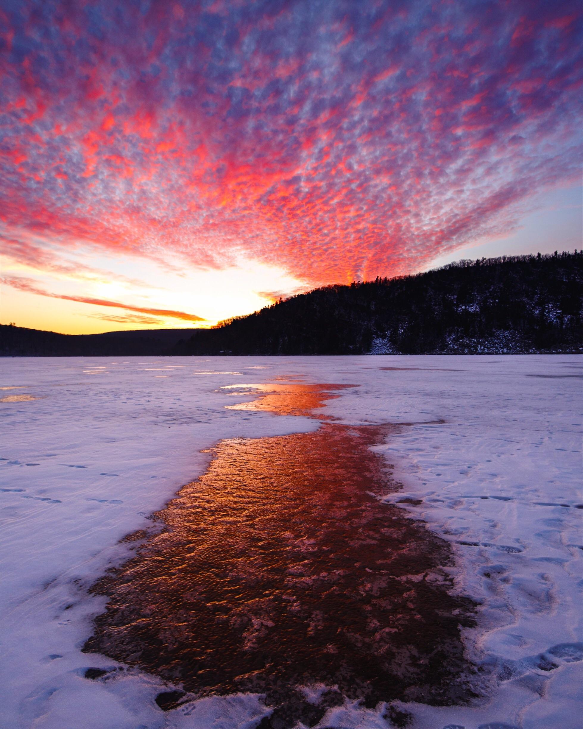 A winter sunset unfolds while walking across Devils Lake in Baraboo, WI
