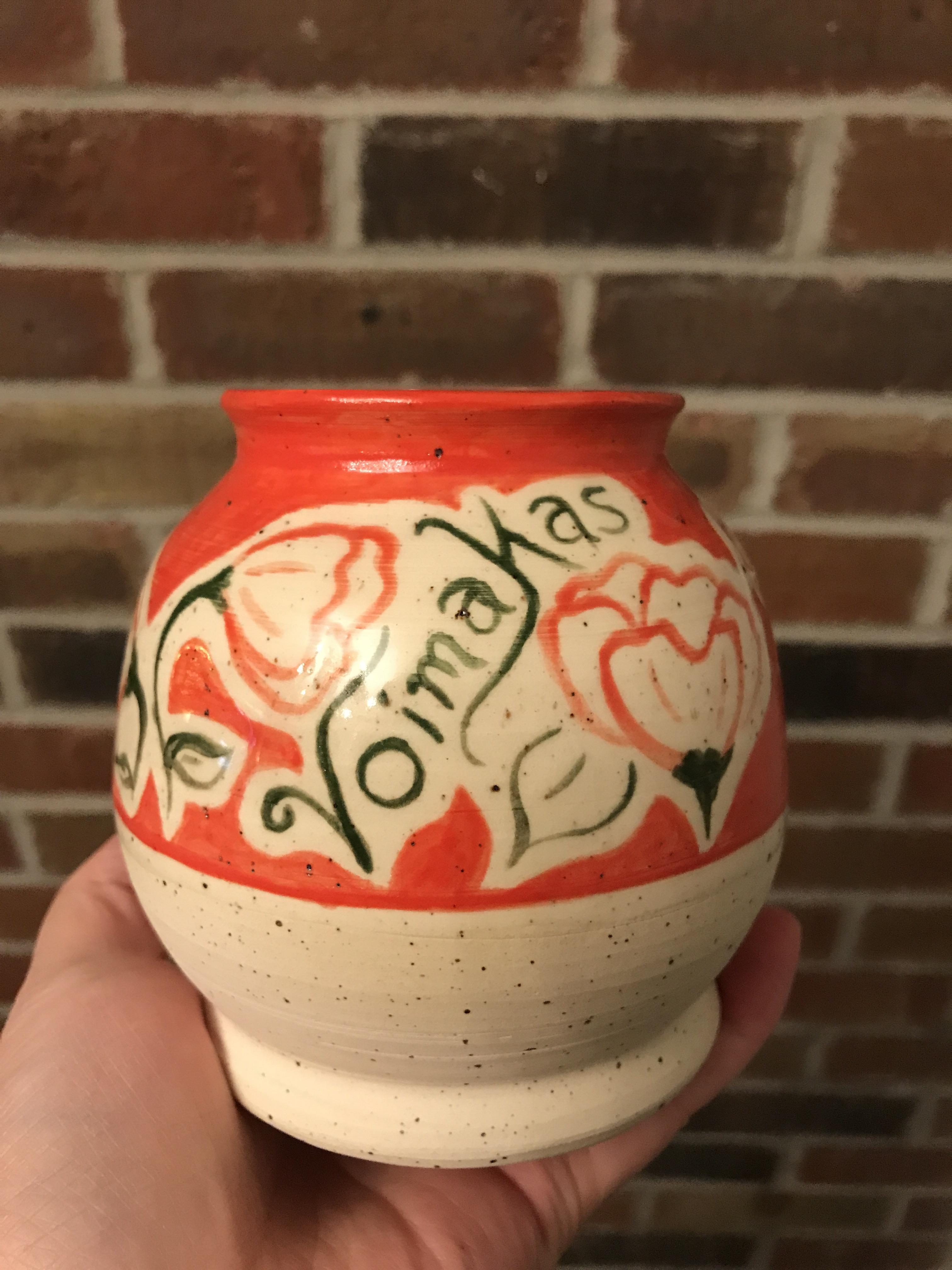 Hand painted flower pot. Only dipped half way in a clear glaze so you