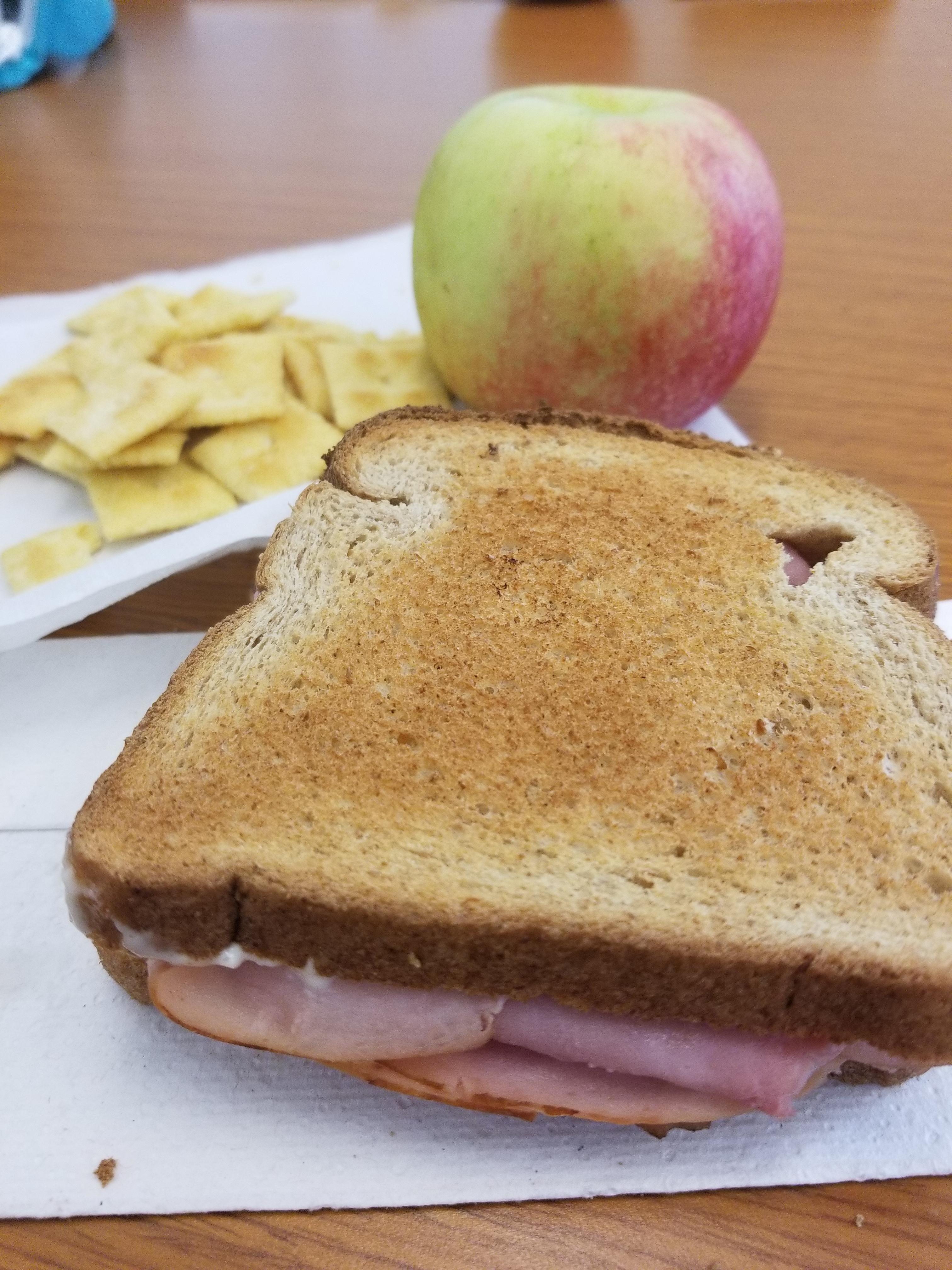 Baked ham and swiss sandwich, white Cheddar cheezits and an apple! 379
