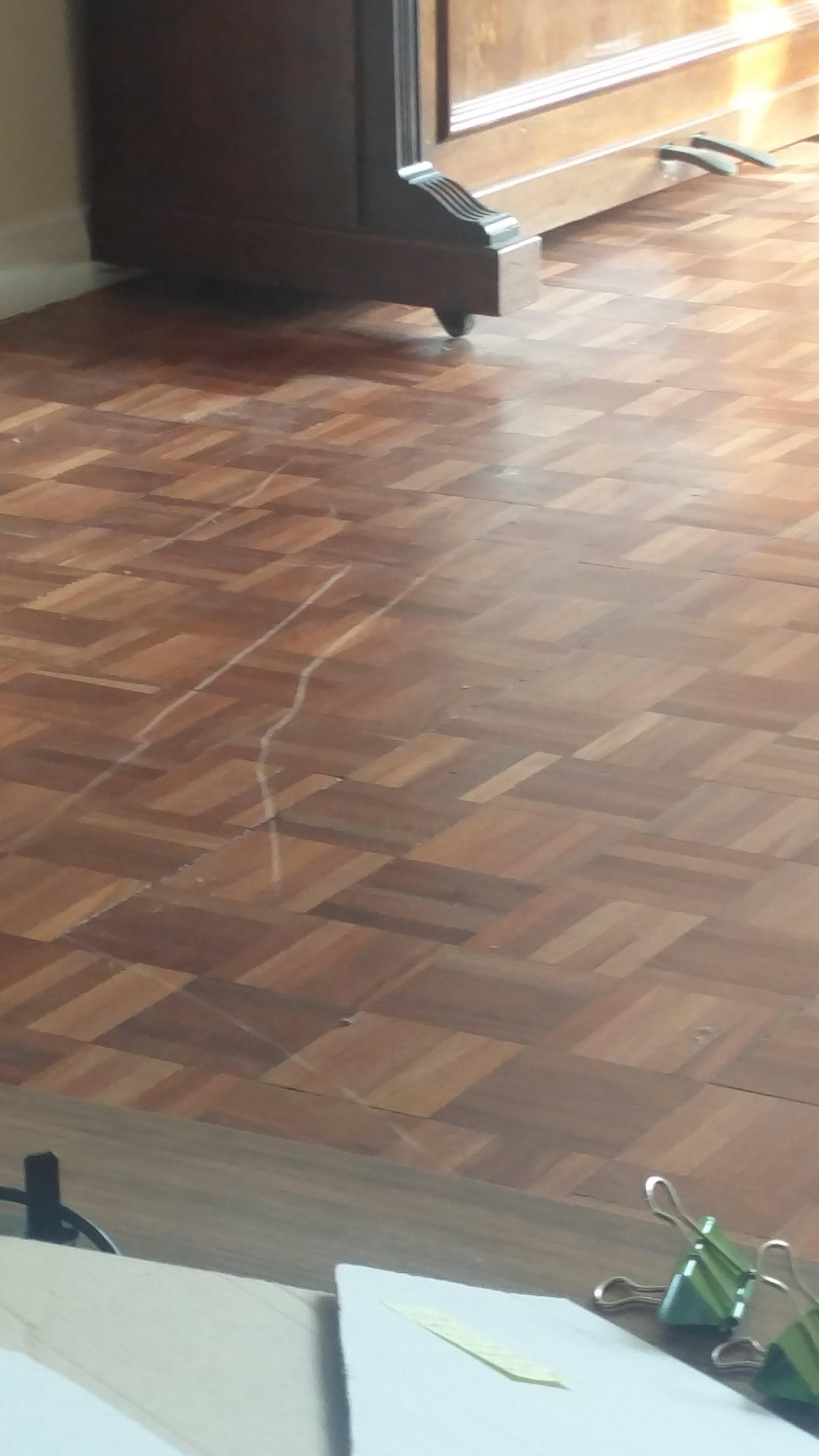 We moved a piano and caused damage to the unsealed wood floor. How can