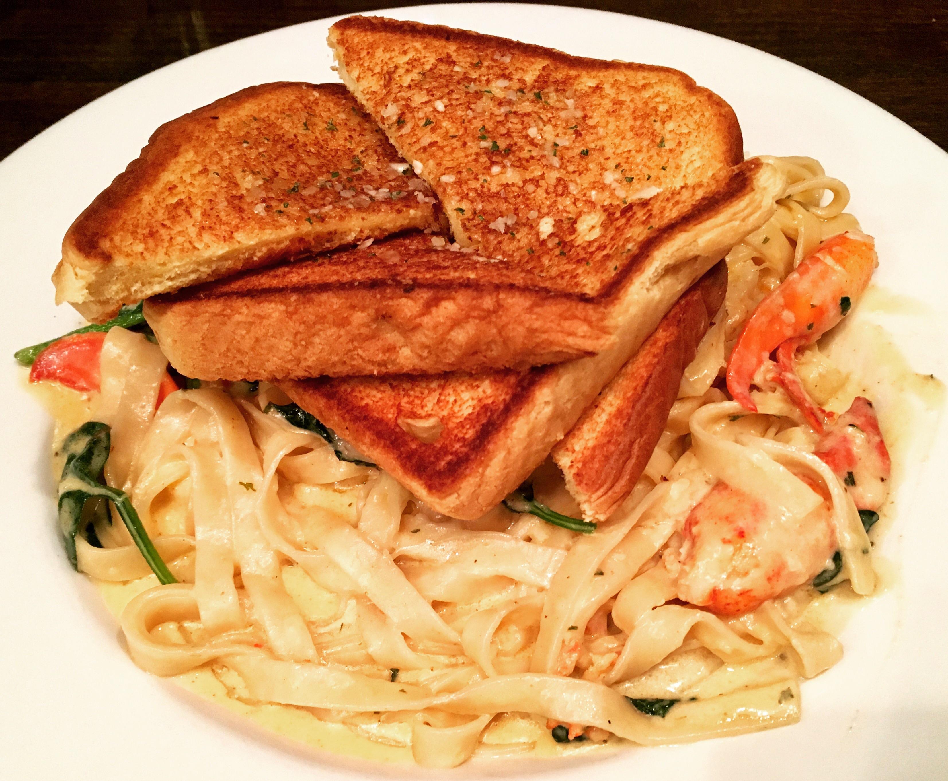 Lobster Fettucine Alfredo Celery, Onions, Fresh Basil, Roasted Red
