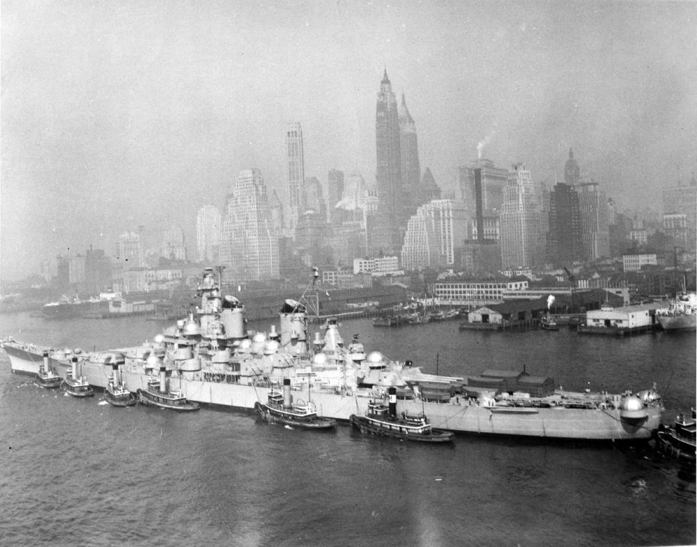 Battleship New Jersey being moved from the New York Navy Yard to the