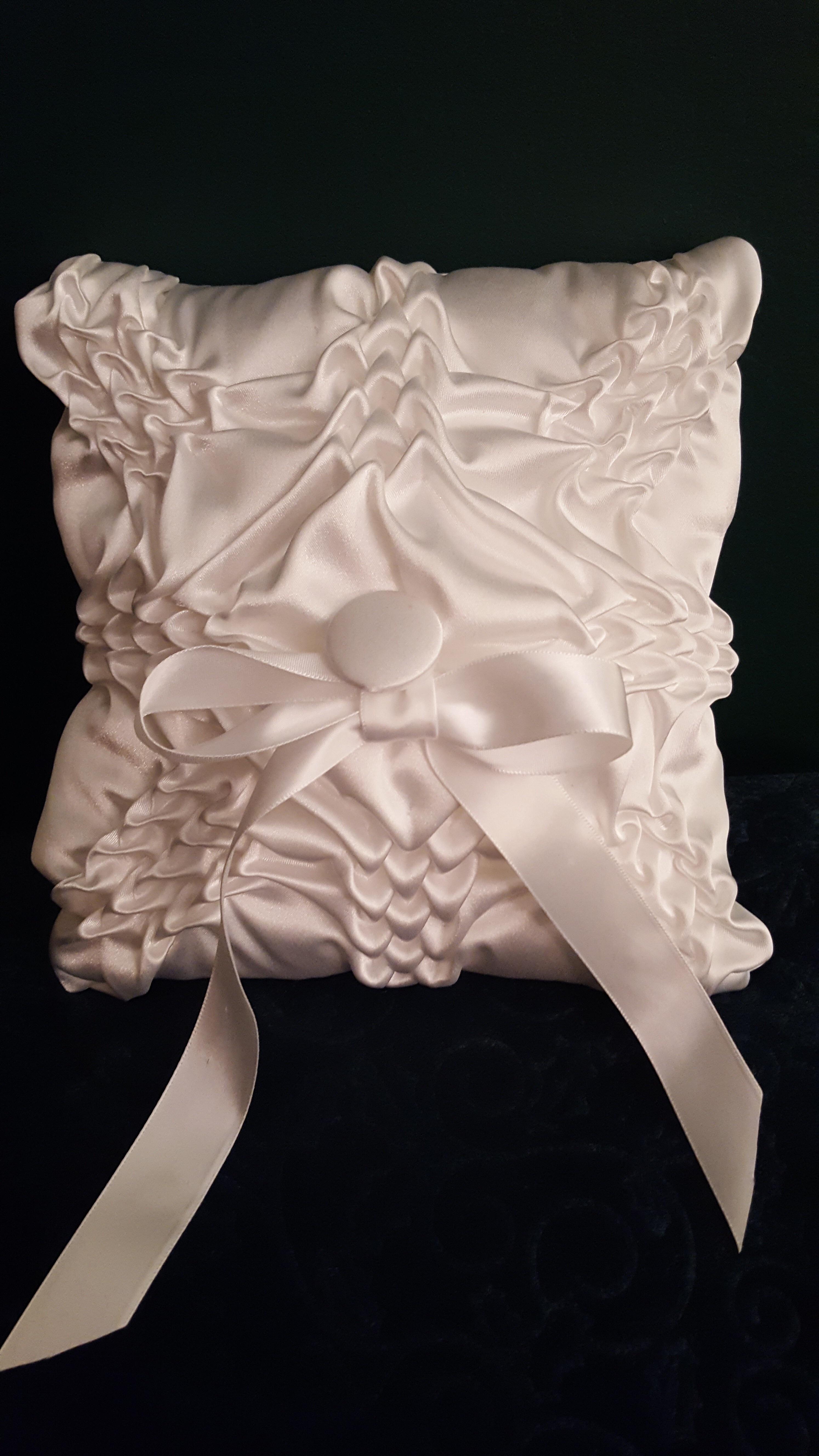 A smocked ring bearers pillow, made from an old wedding gown. crafts