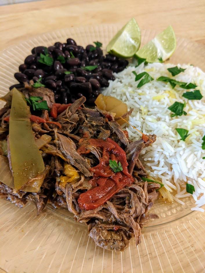 Cuban Ropa Vieja with black beans and rice. So good! r/slowcooking