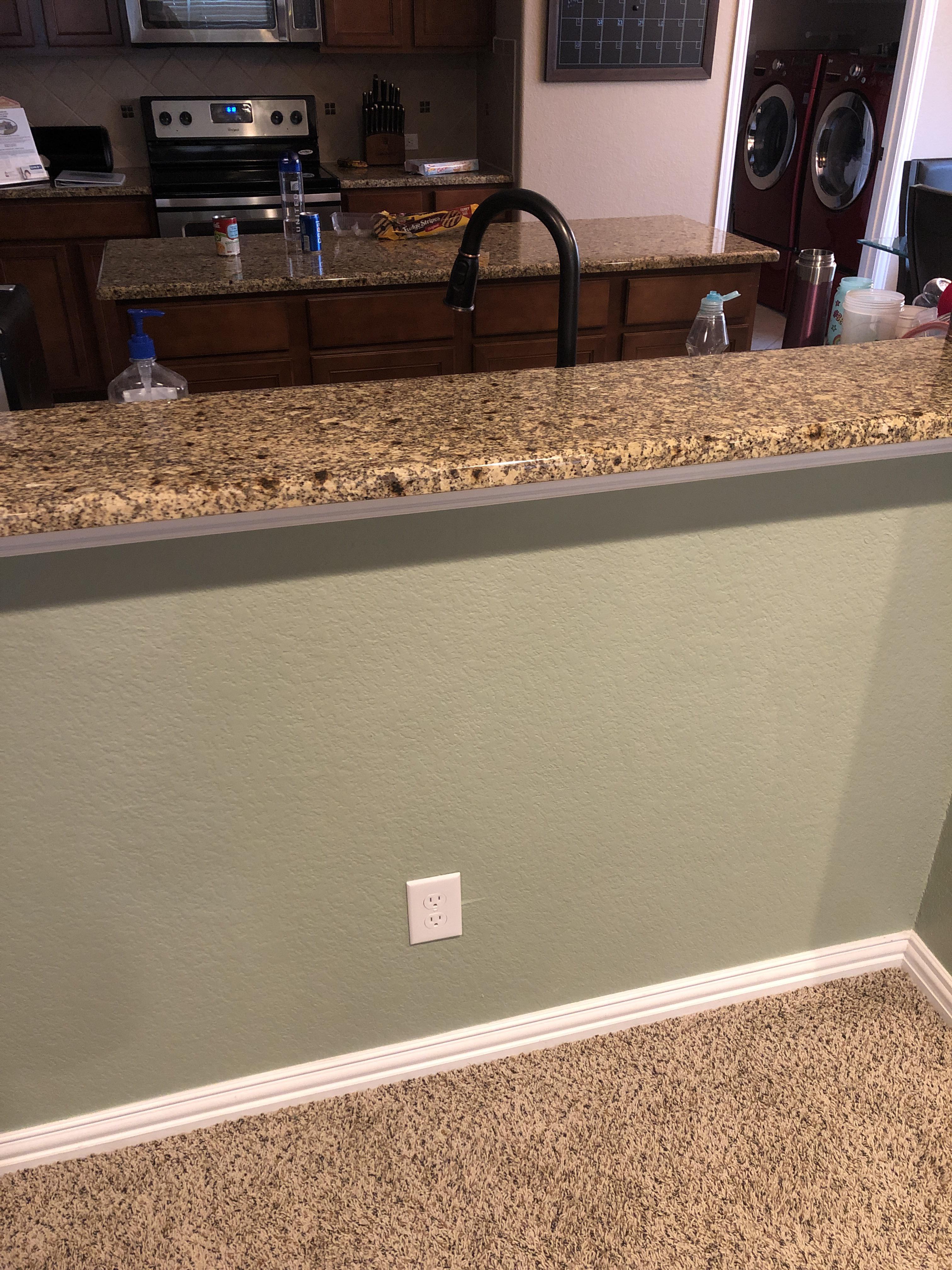 Is a gfci outlet needed in a different room but behind a kitchen sink