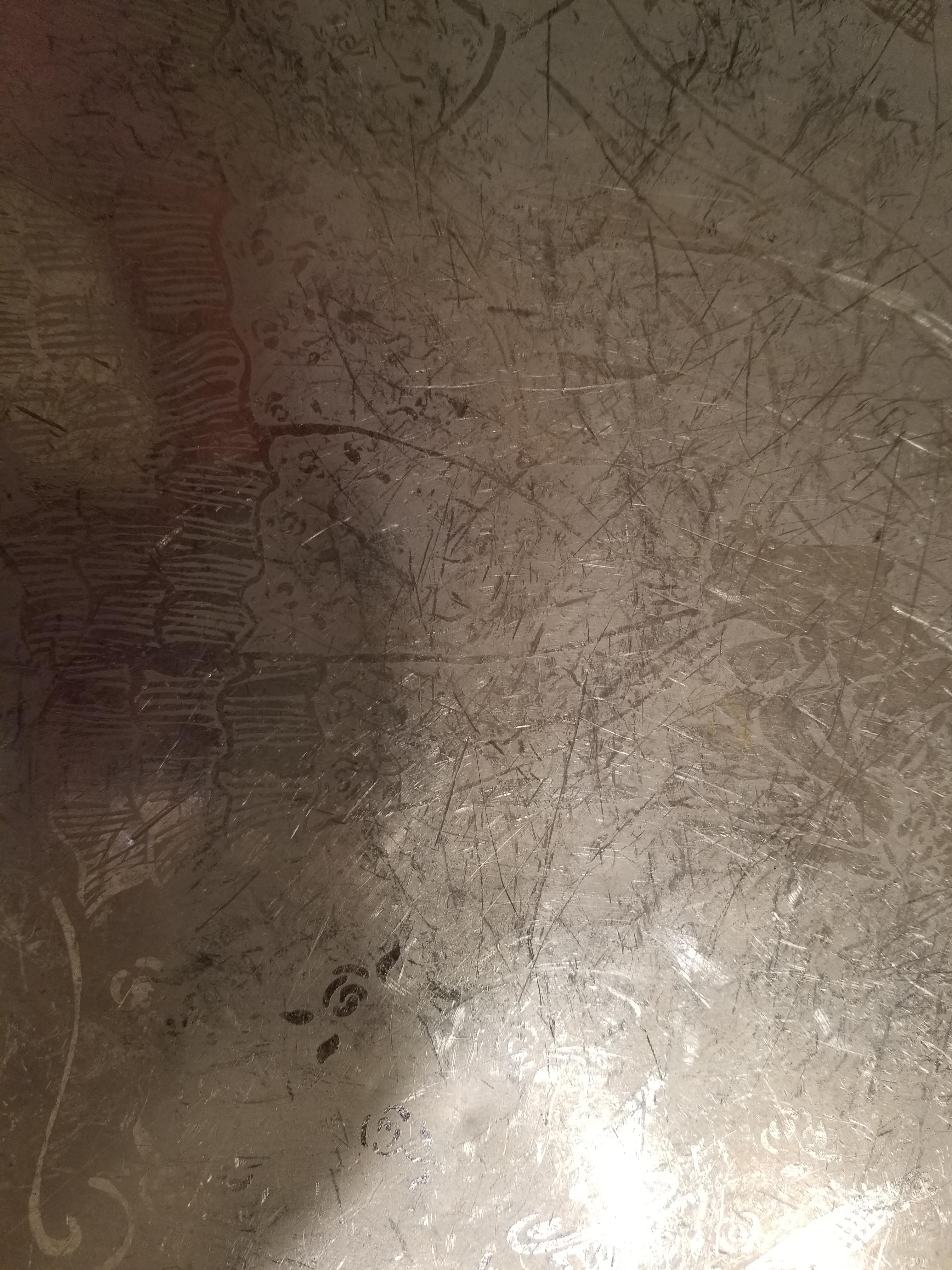 How do you get scratches out of aluminum without hurting the artwork that's already there? r/howto