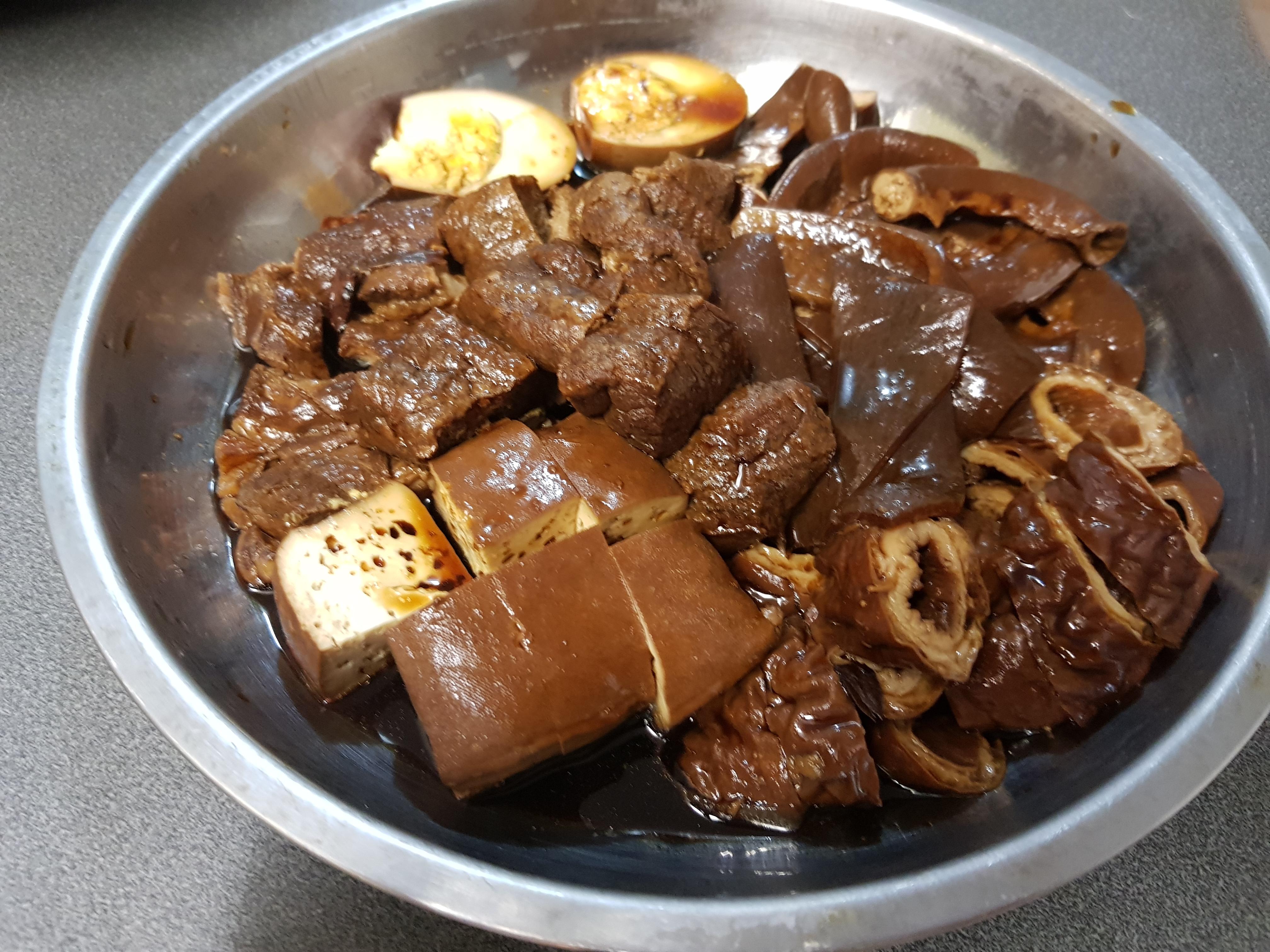 Pork intestines, skin, cheeks, tofu and tofu puffs braised in a soy