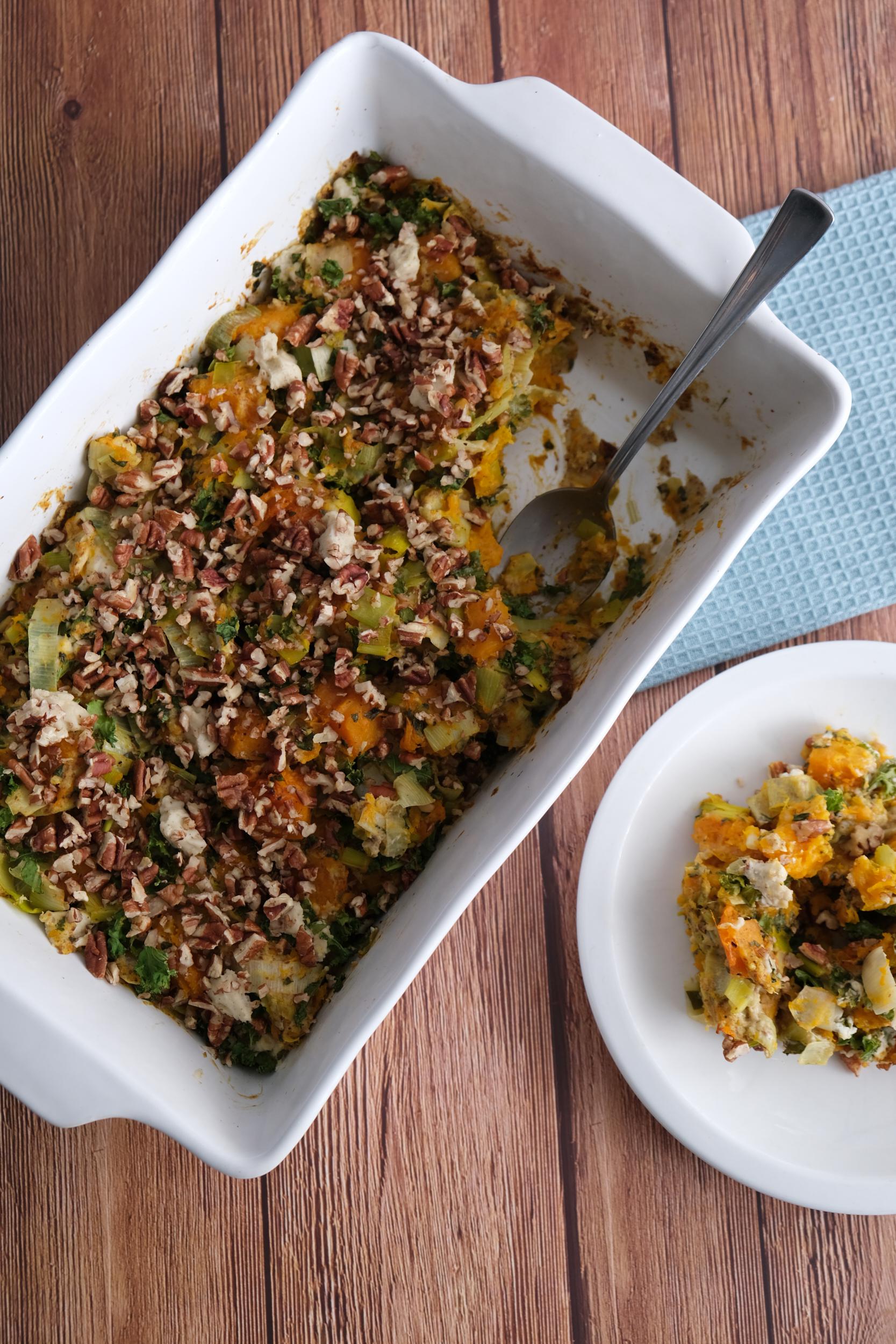 Delicious butternut squash casserole with leeks, kale, pecans, and