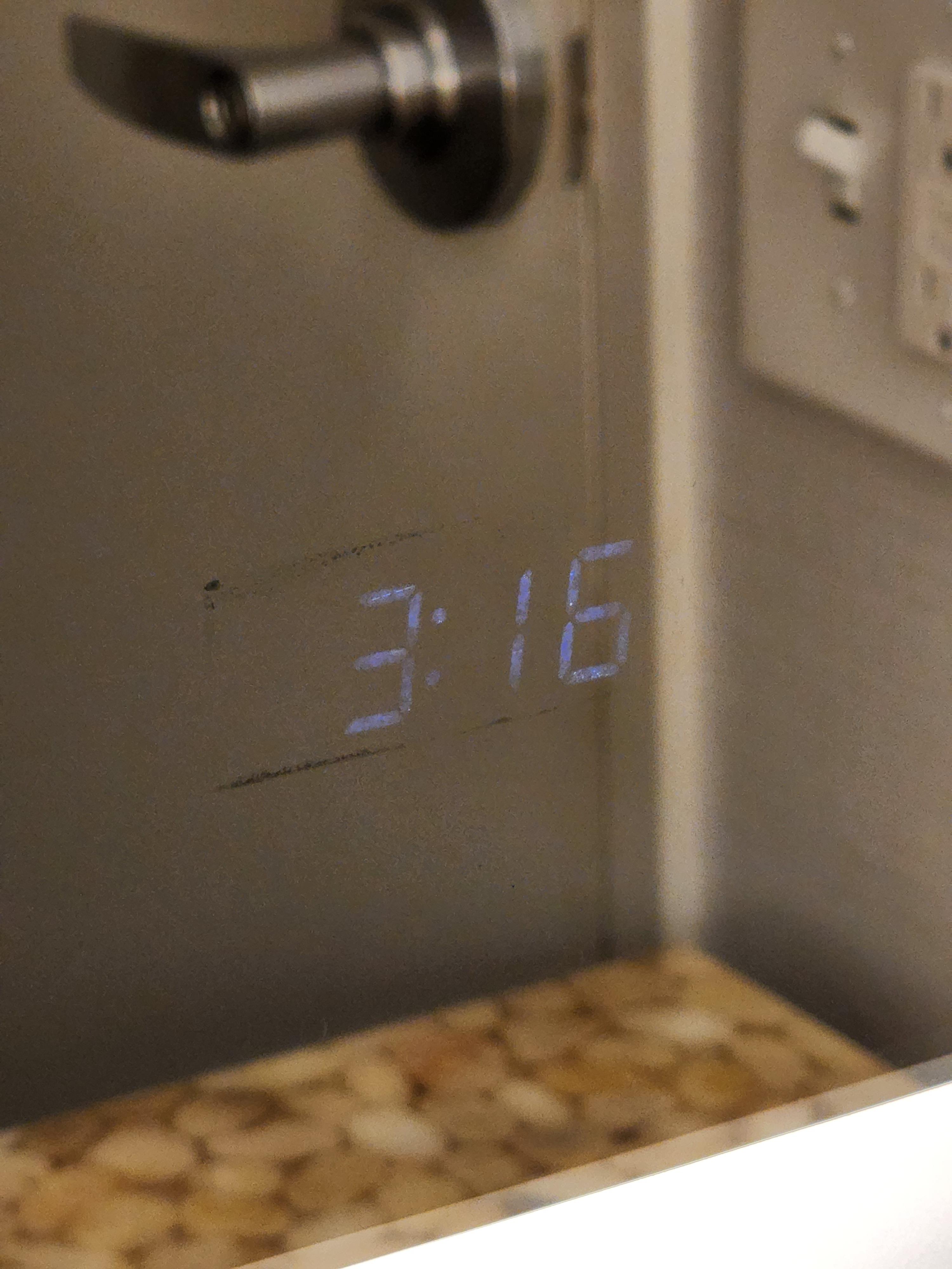 This mirror in my hotel bathroom has a builtin clock. r